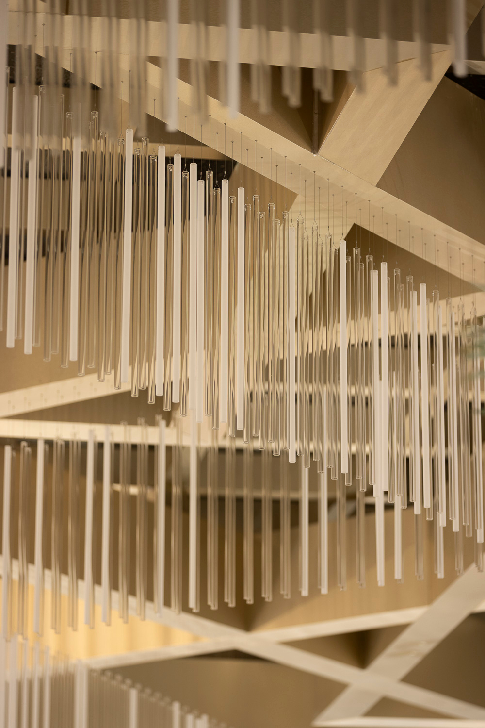 KEATON glass rods hung against the beamed ceiling structure
