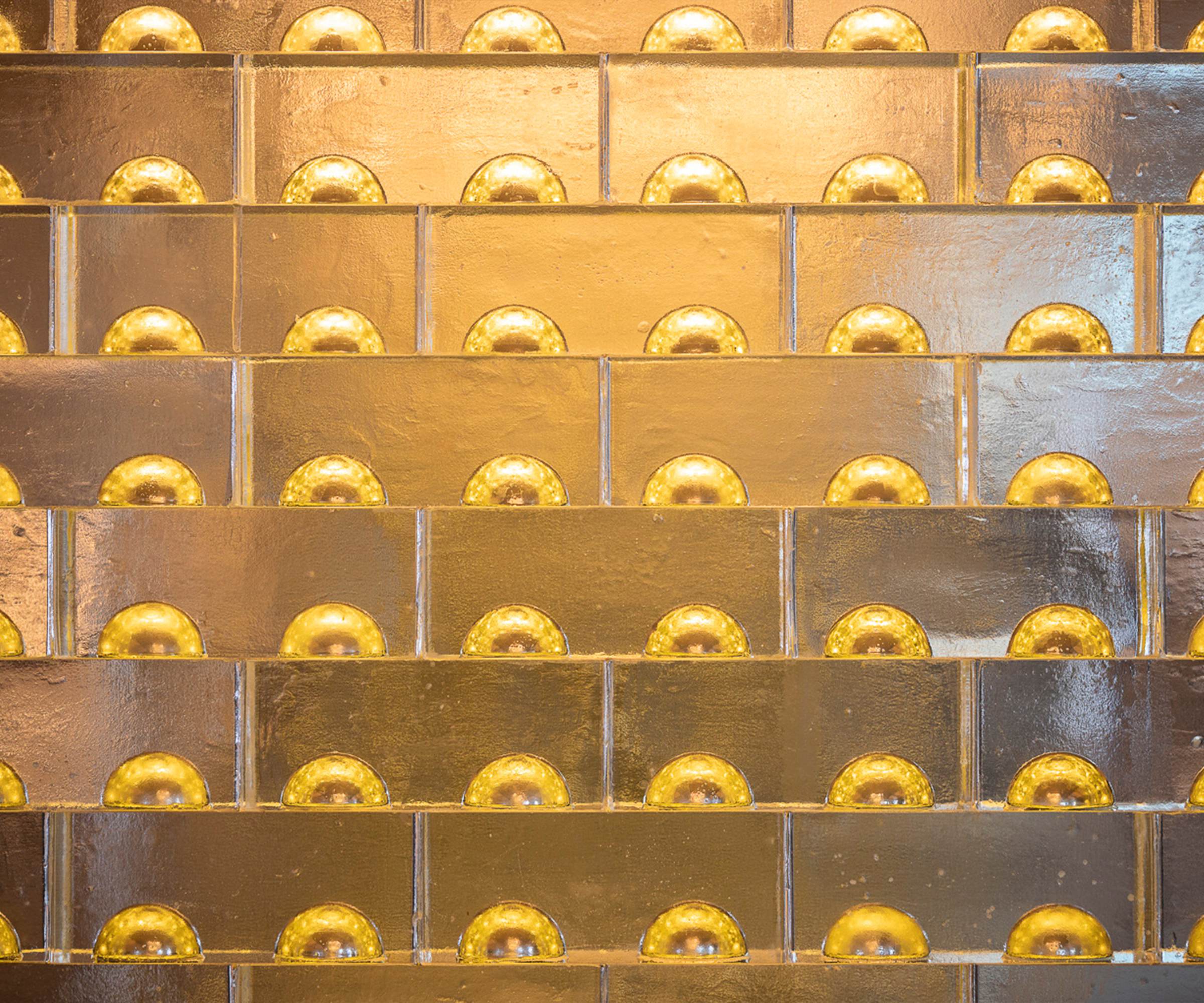 MIDAS glass screen, close view of the gilded half-domes inside the bricks