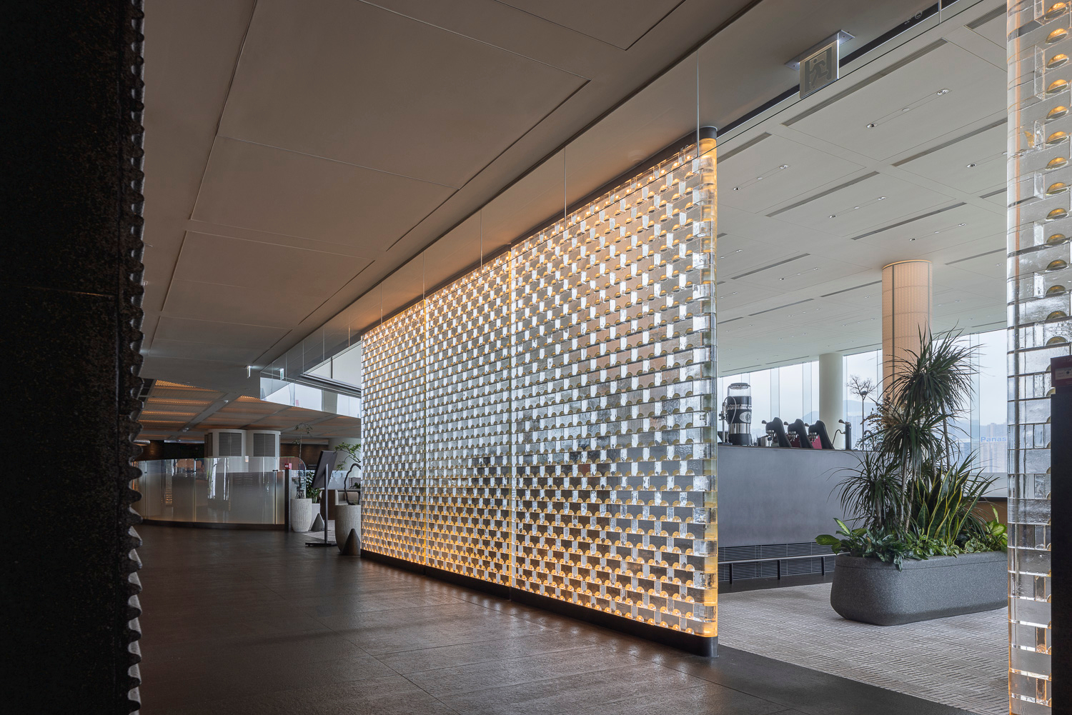 MIDAS illuminated screen seen as a full-height room divider
