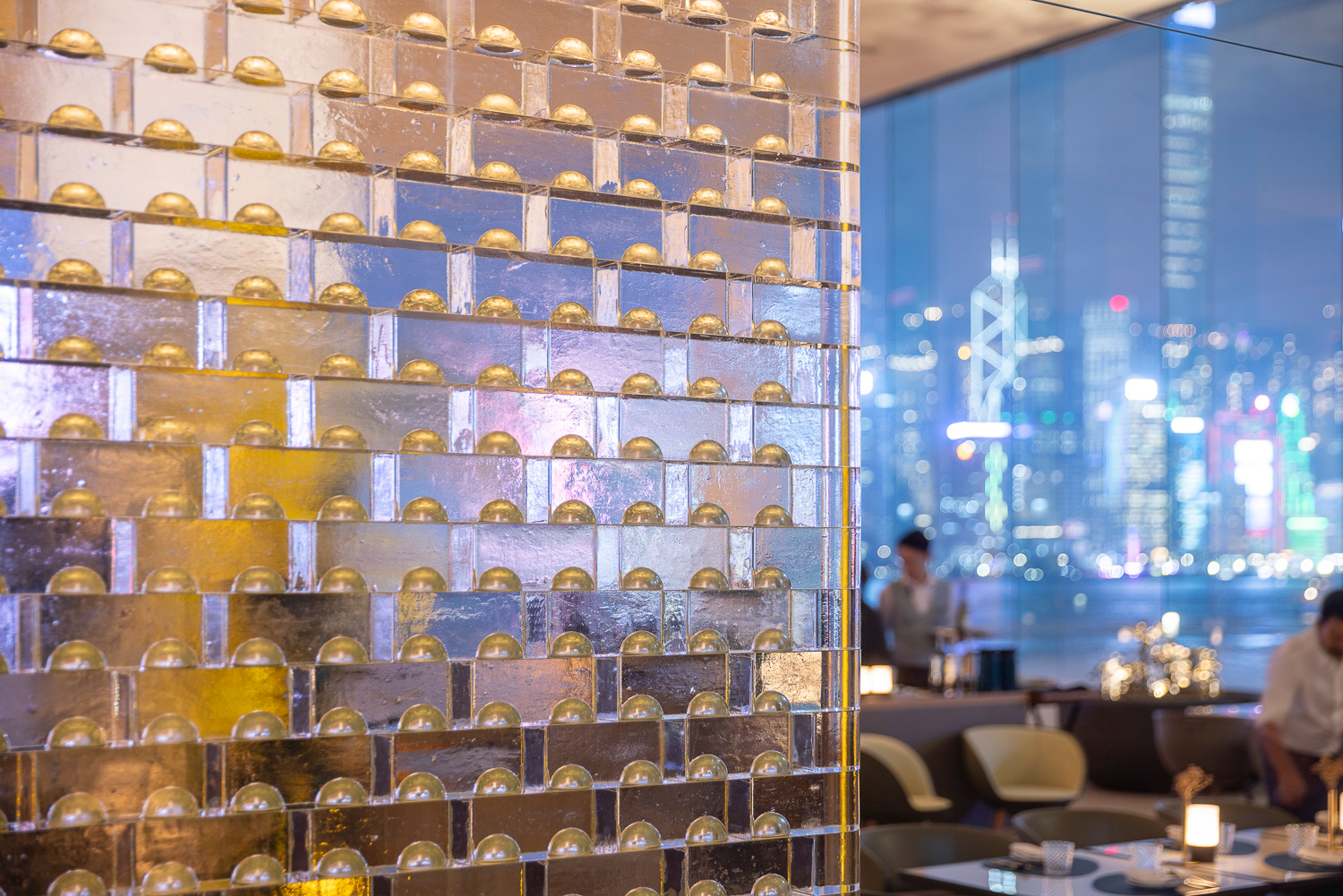 MIDAS glass bricks lit against a night window