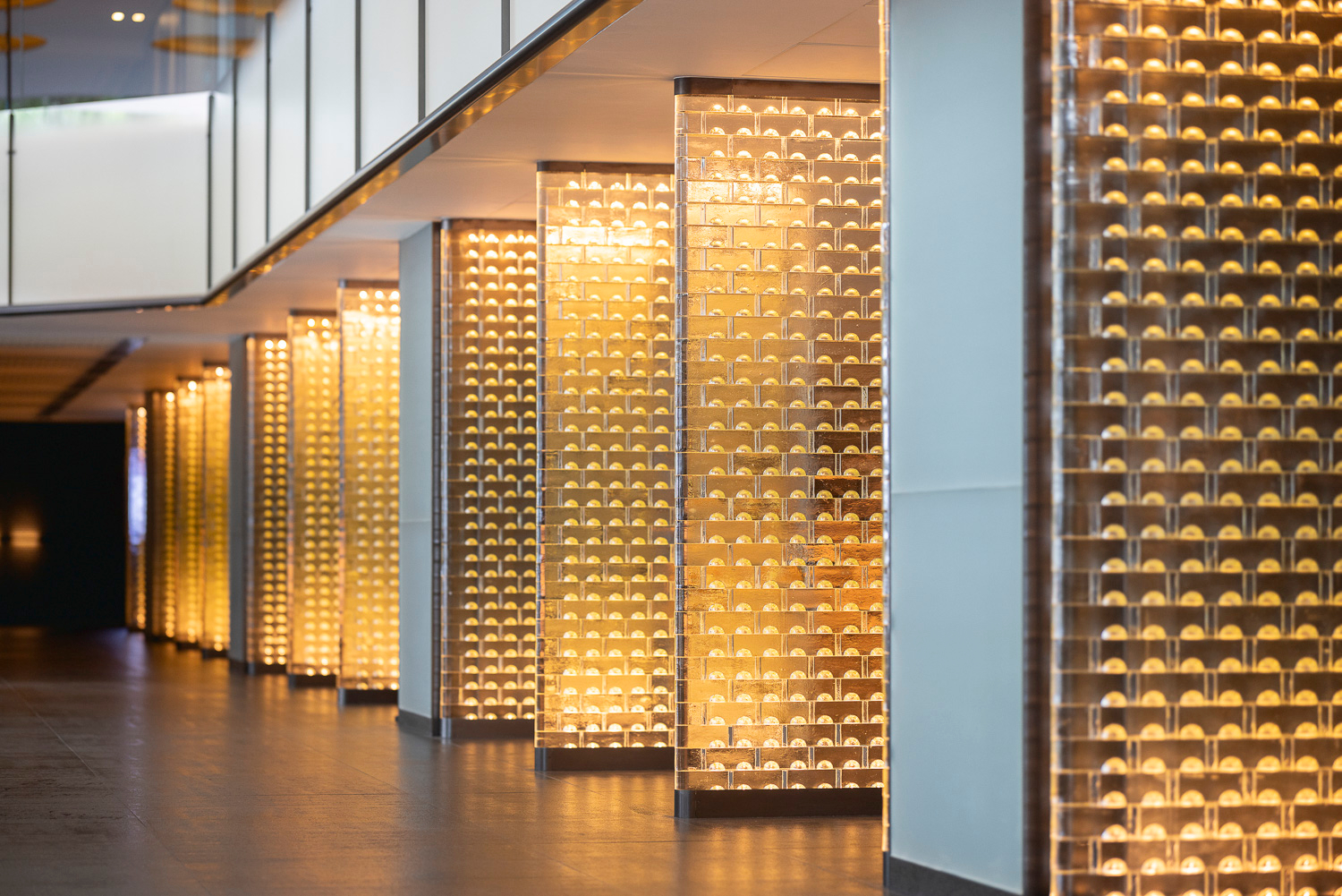 MIDAS illuminated glass screen by SHUCHUANG, free-standing panels in a restaurant