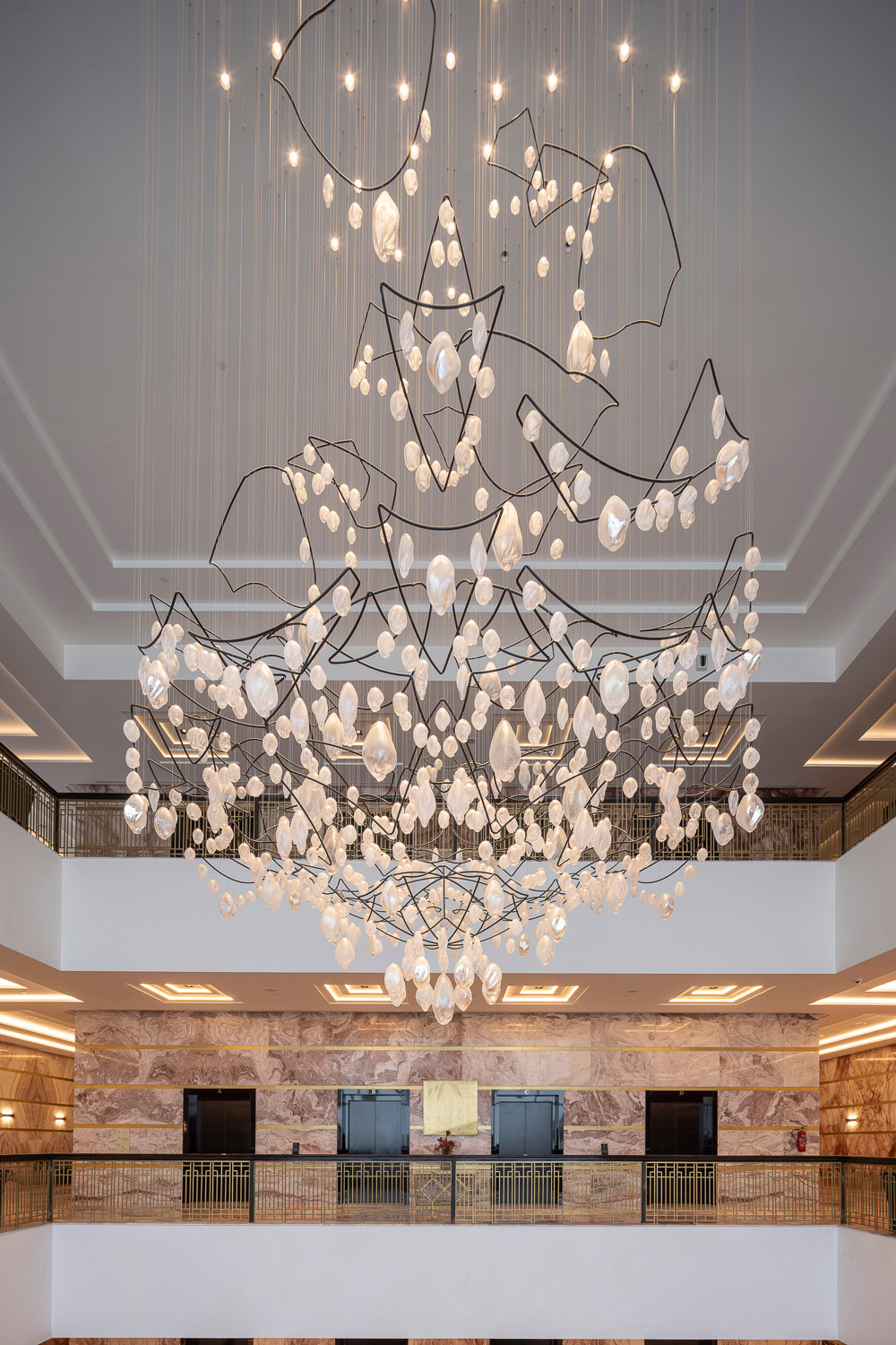 SOLACE chandelier over the reception, full spread visible