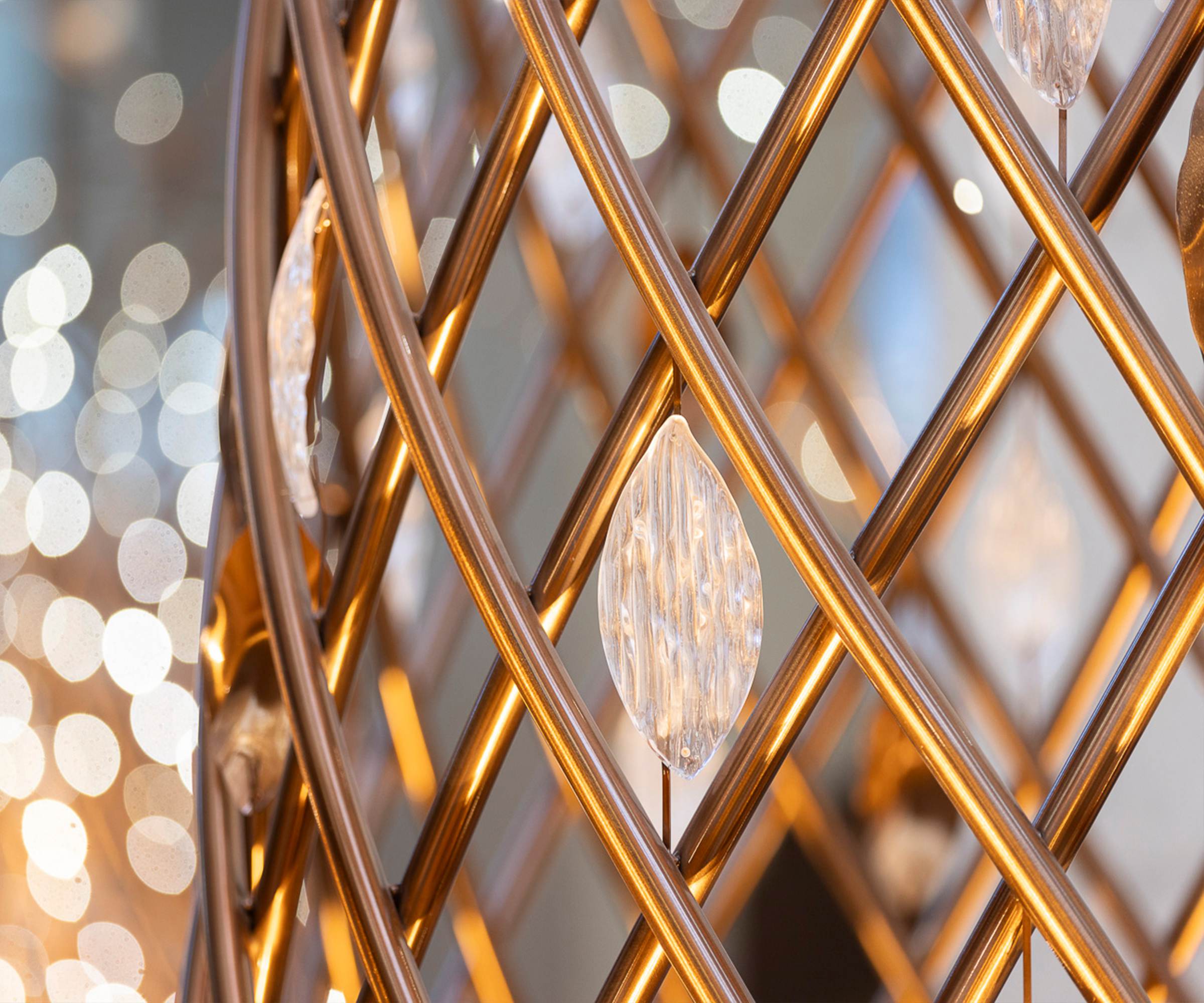 MARQUISE glass form held inside the gilded lattice