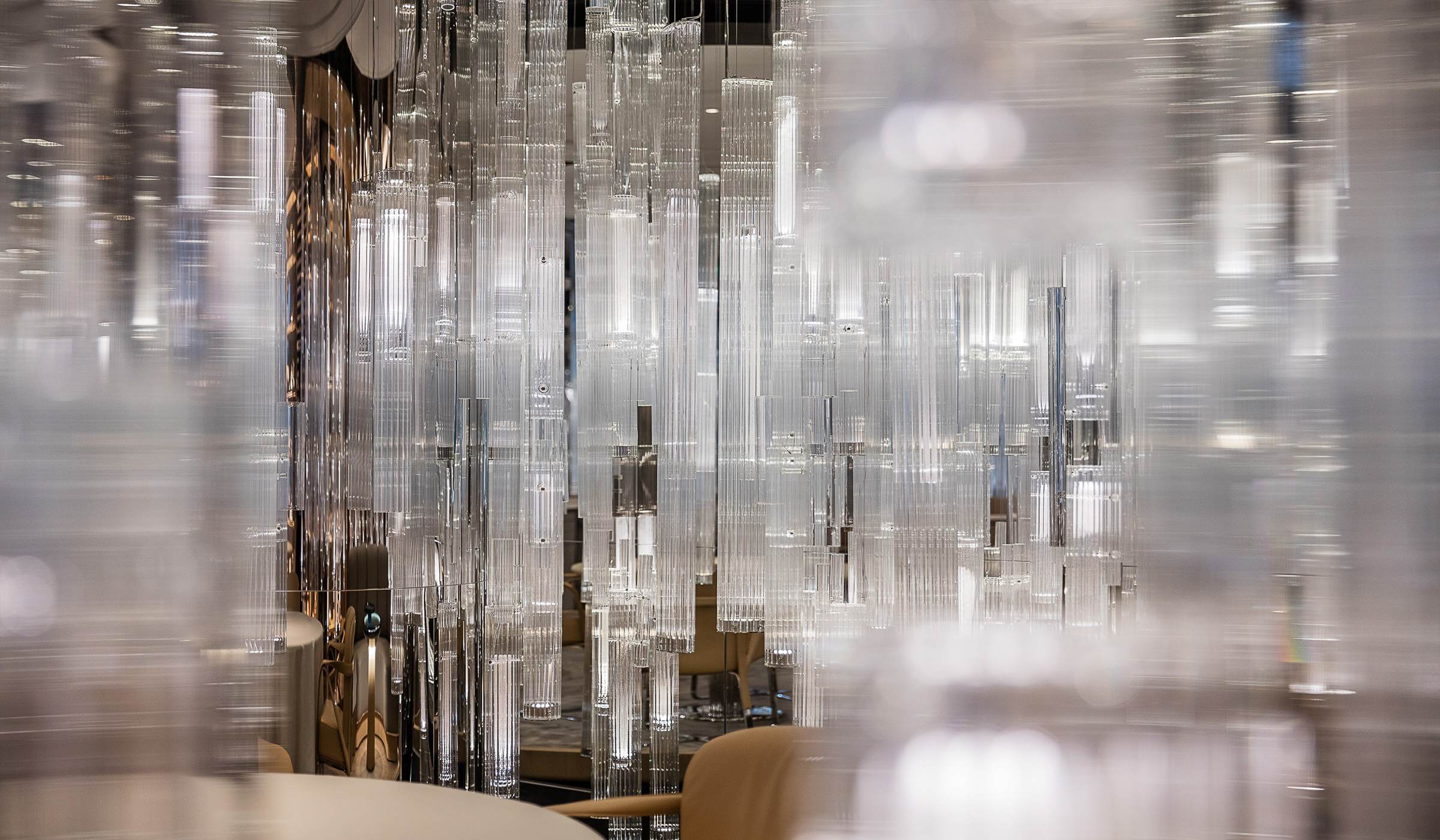 GROVE glass stems seen against the lounge seating