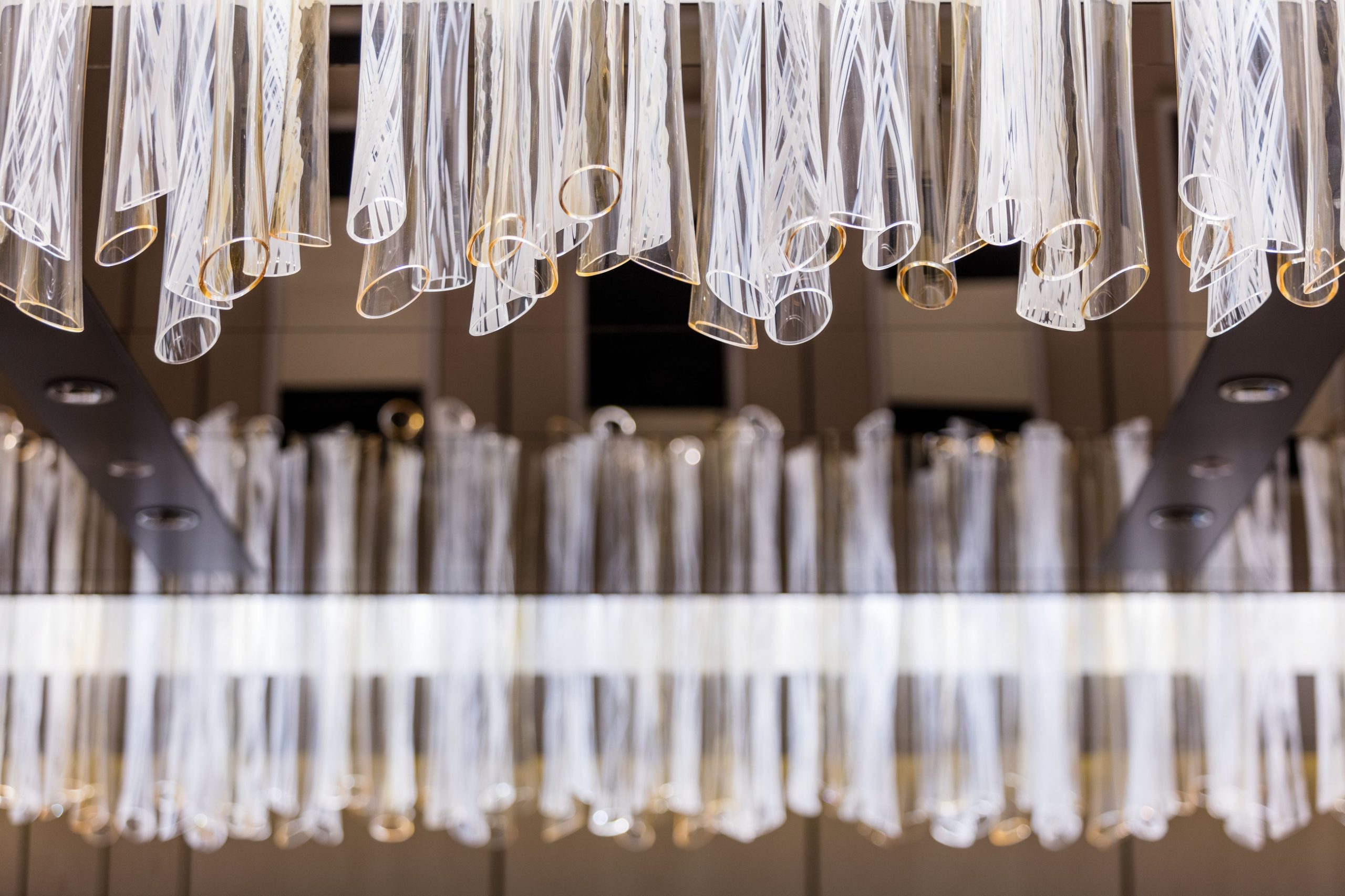 LUXE tiered glass ceiling light by SHUCHUANG, concentric rectangular tiers over a ballroom