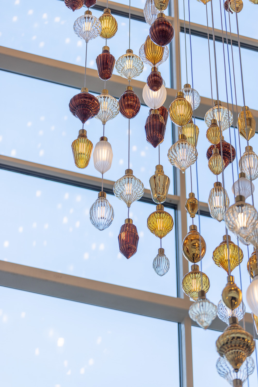 BUTTONWOOD glass discs seen against the stair soffit