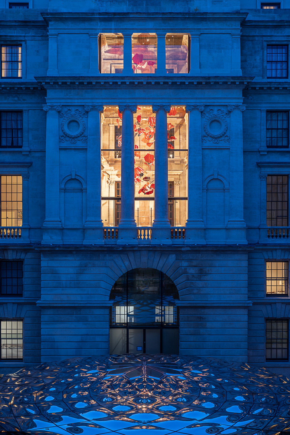 ROSSO installation seen from outside the building at night