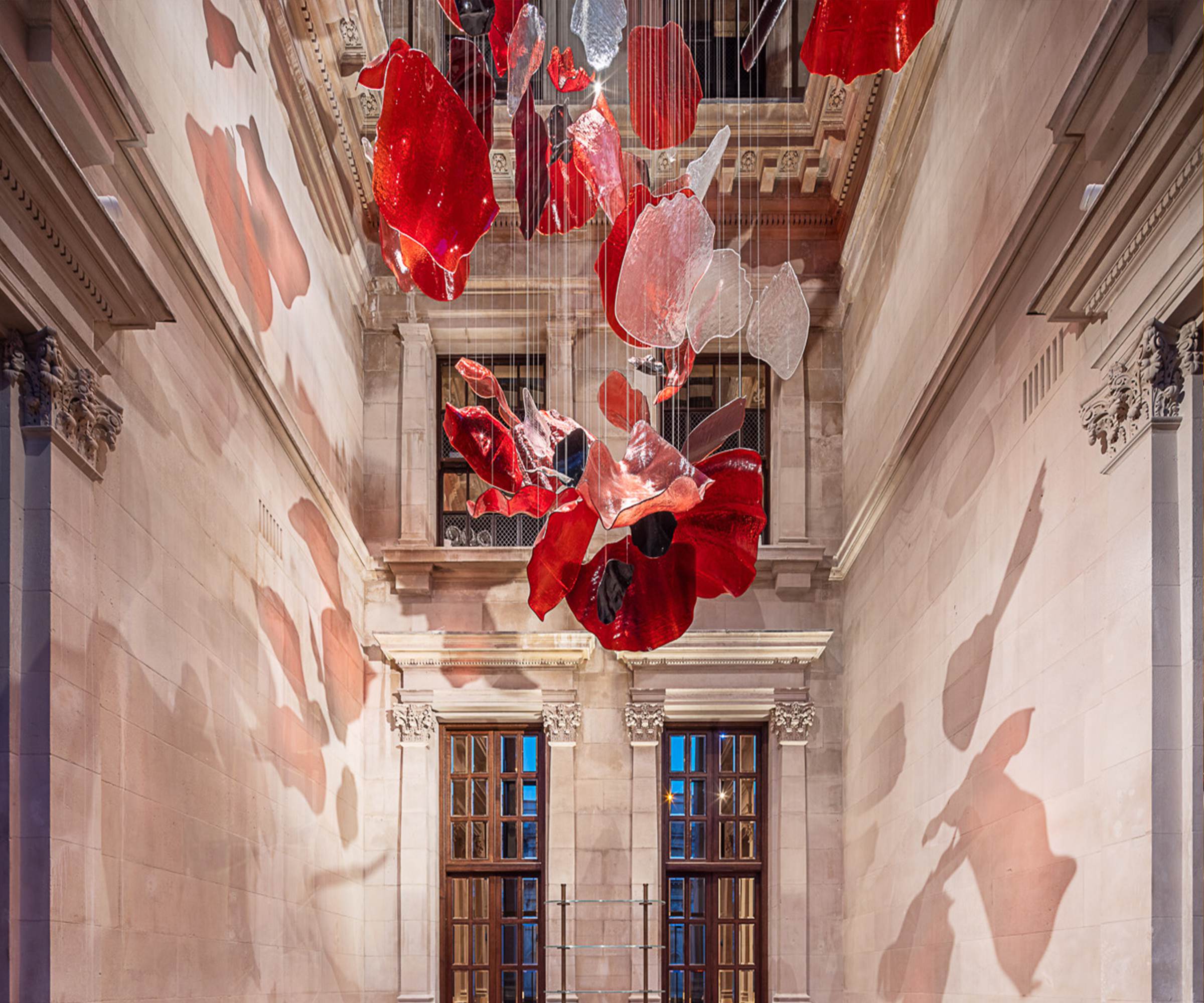 ROSSO red glass forms against the cornice