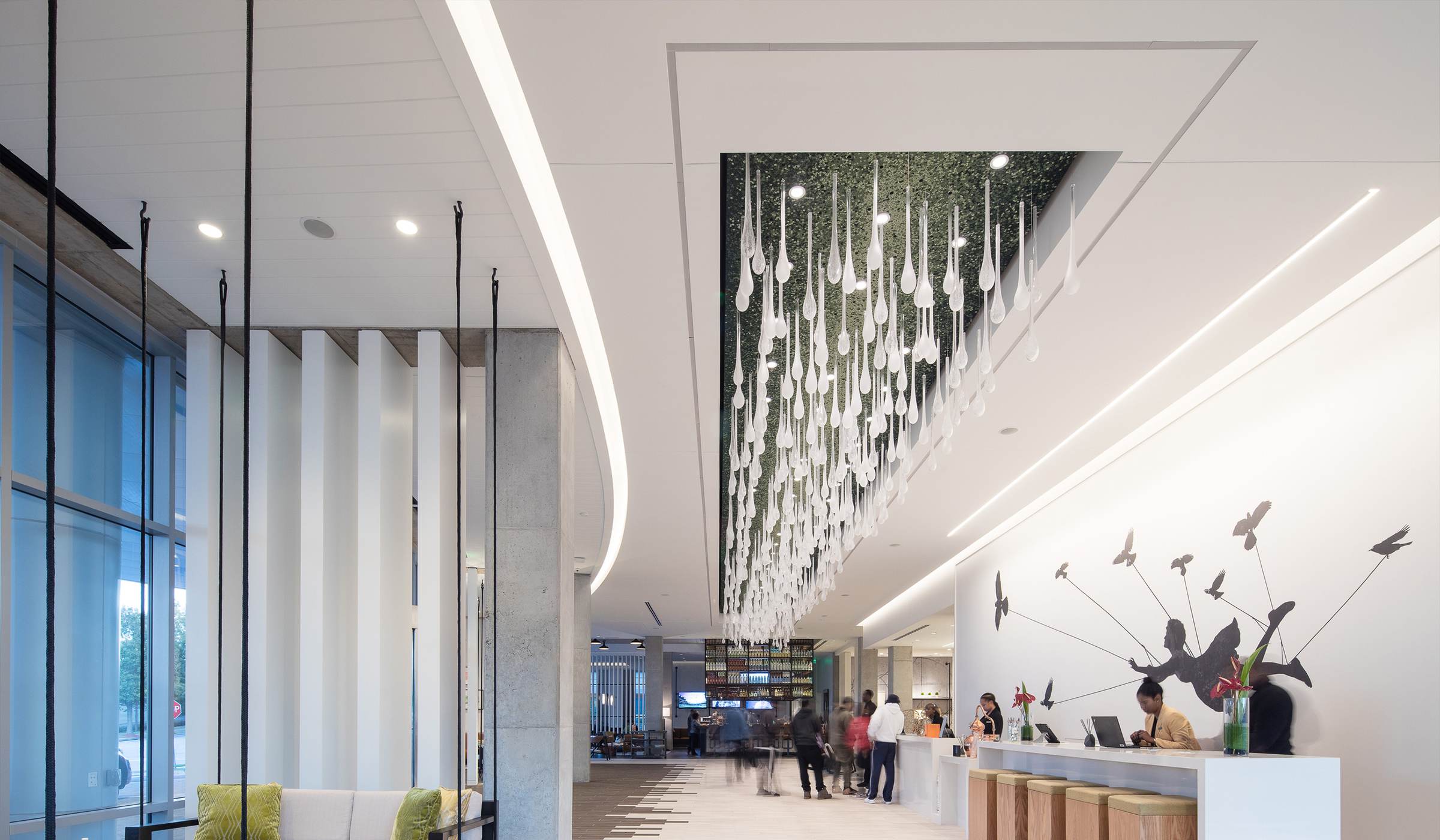 MYCELIUM glass tendril ceiling light by SHUCHUANG, dropping from a green ceiling panel