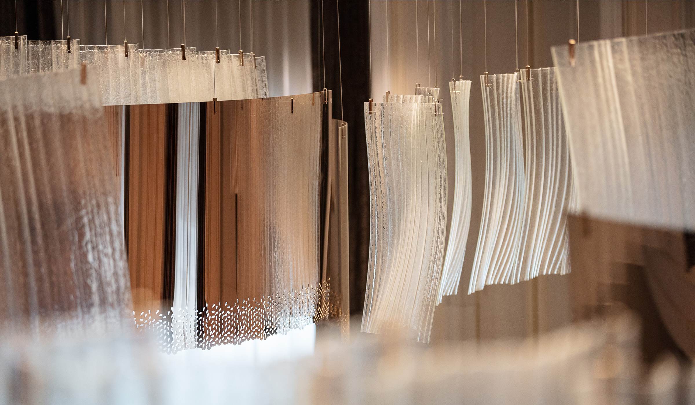 RIBBON glass strand curtain with pierced metal border, close view