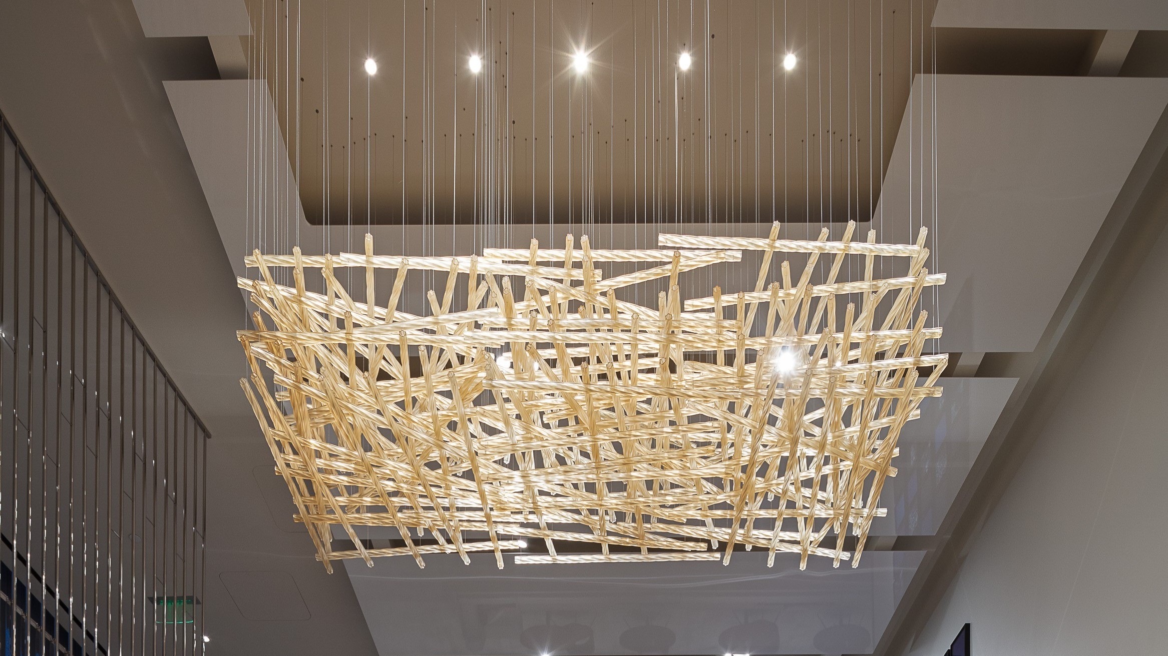 WOVEN chandelier seen from below, open weave against the ceiling