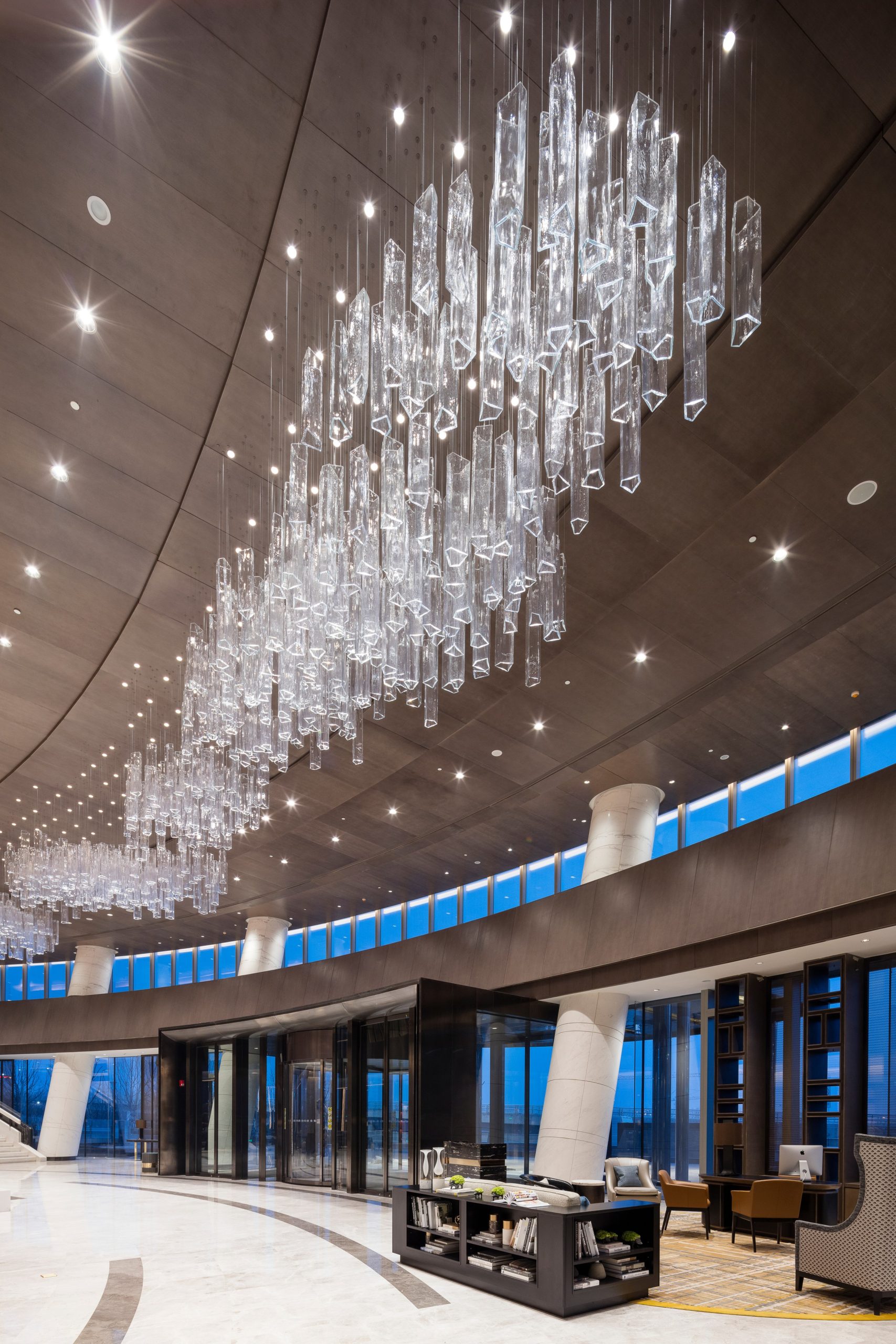 CYLINDER ceiling field seen against the lobby glazing