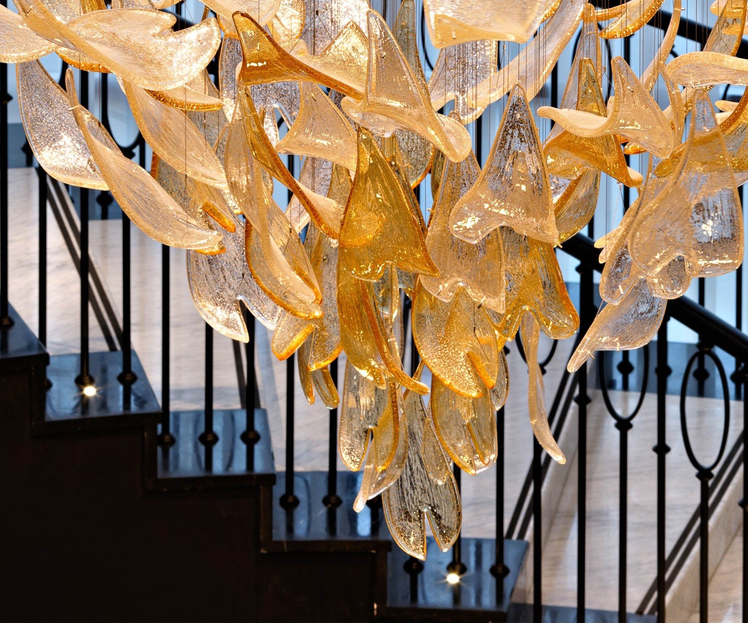 GOLDFINCH crystal leaf chandelier seen from the lobby below