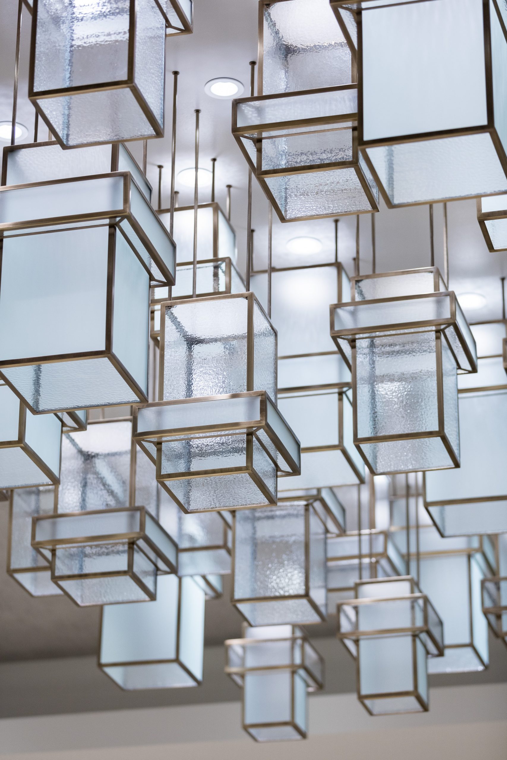 BRASS boxes clustered at different heights, close detail