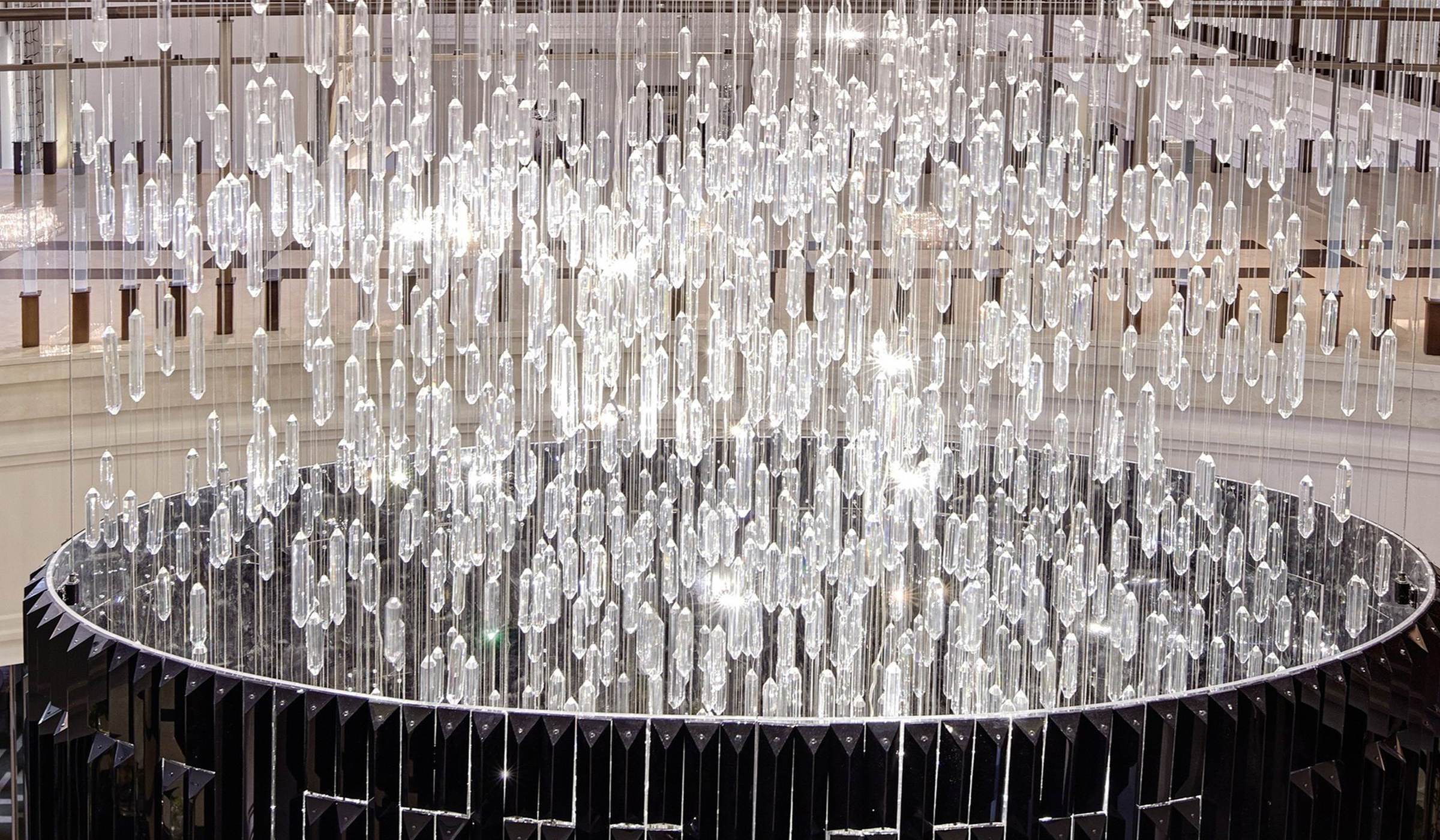 RAINFALL chandelier following the curve of the rotunda