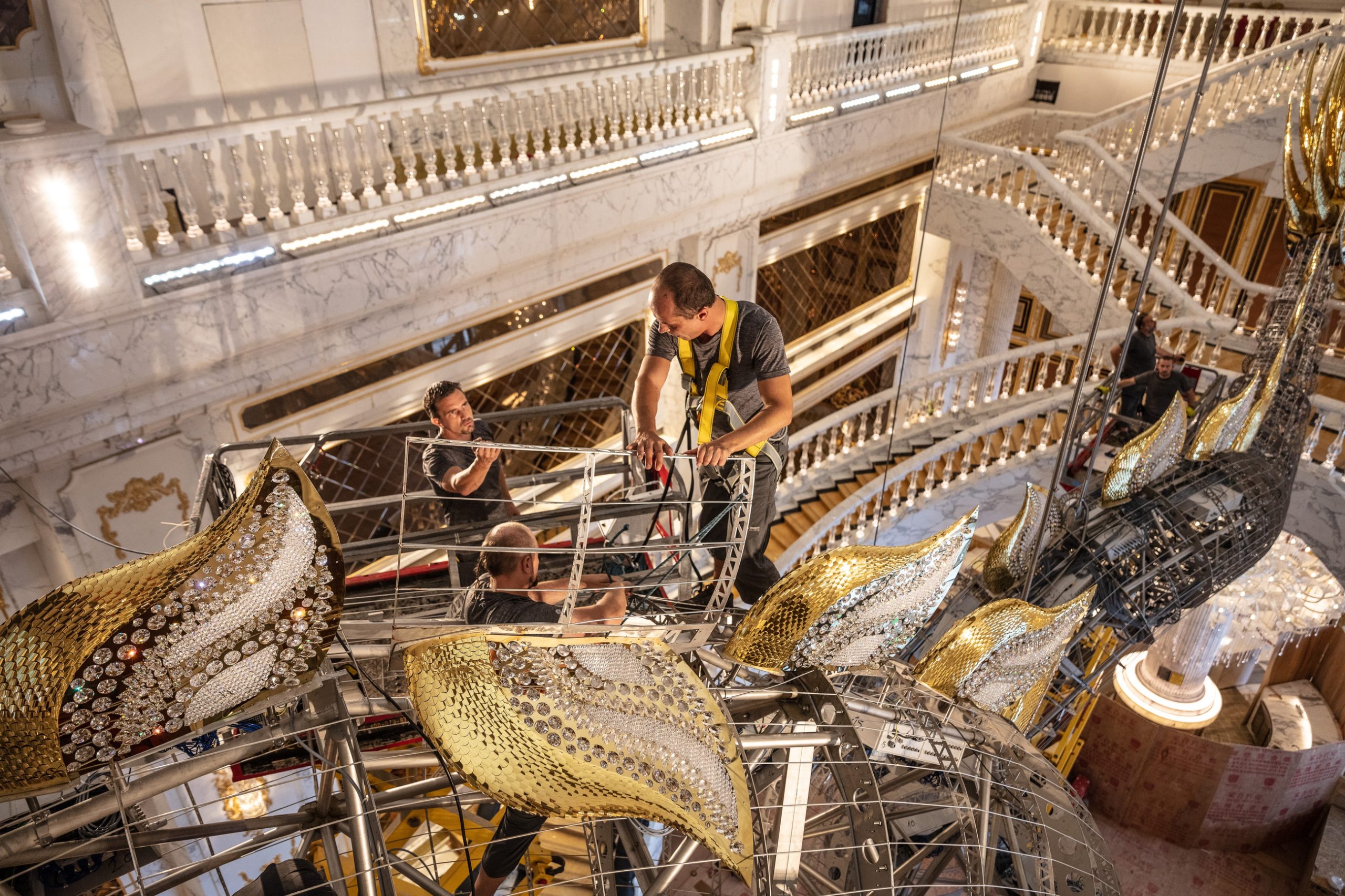 AUGUSTUS dragon chandelier, gilded fins against the crystal body