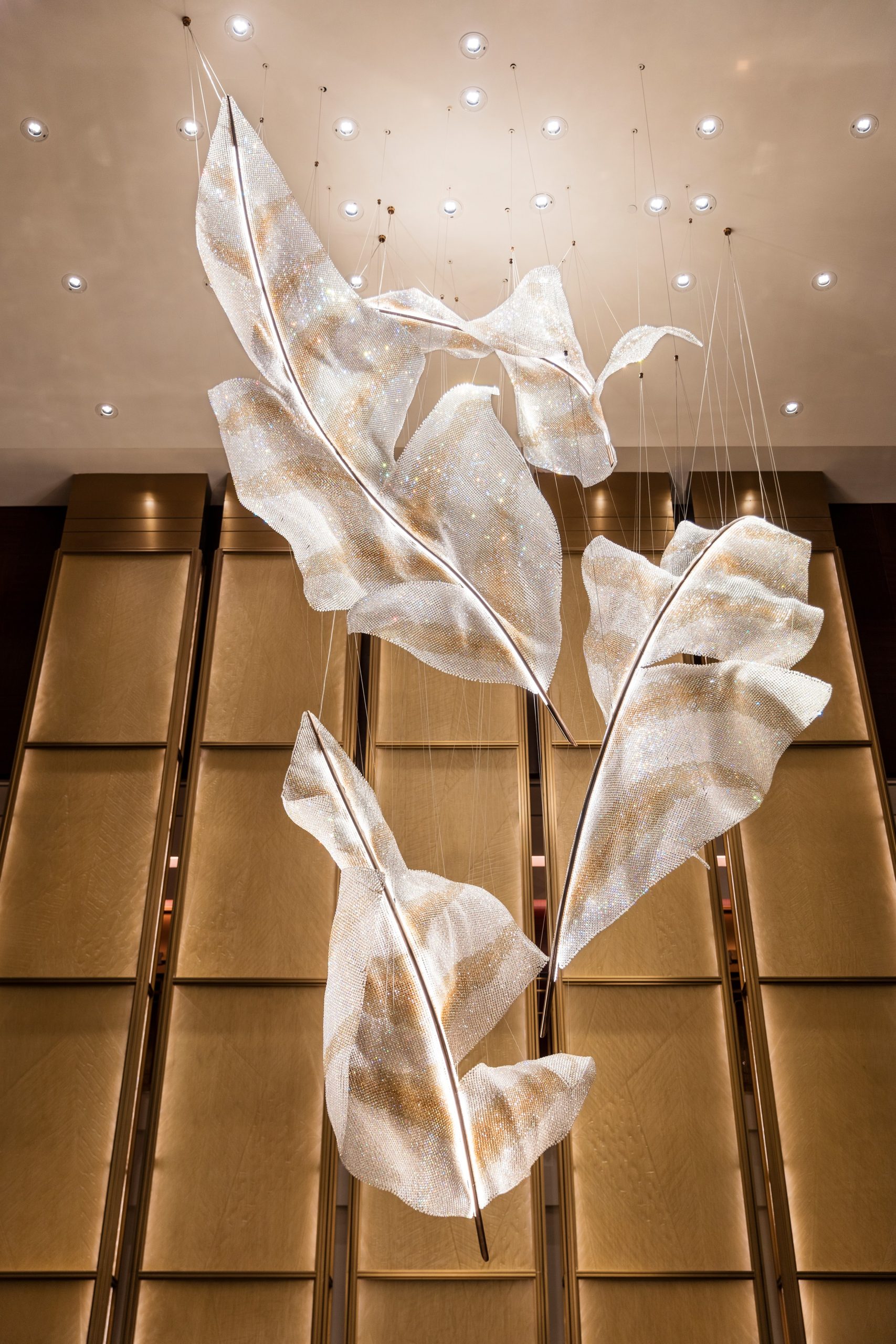 ARIA crystal feather forms above a hotel lobby lounge