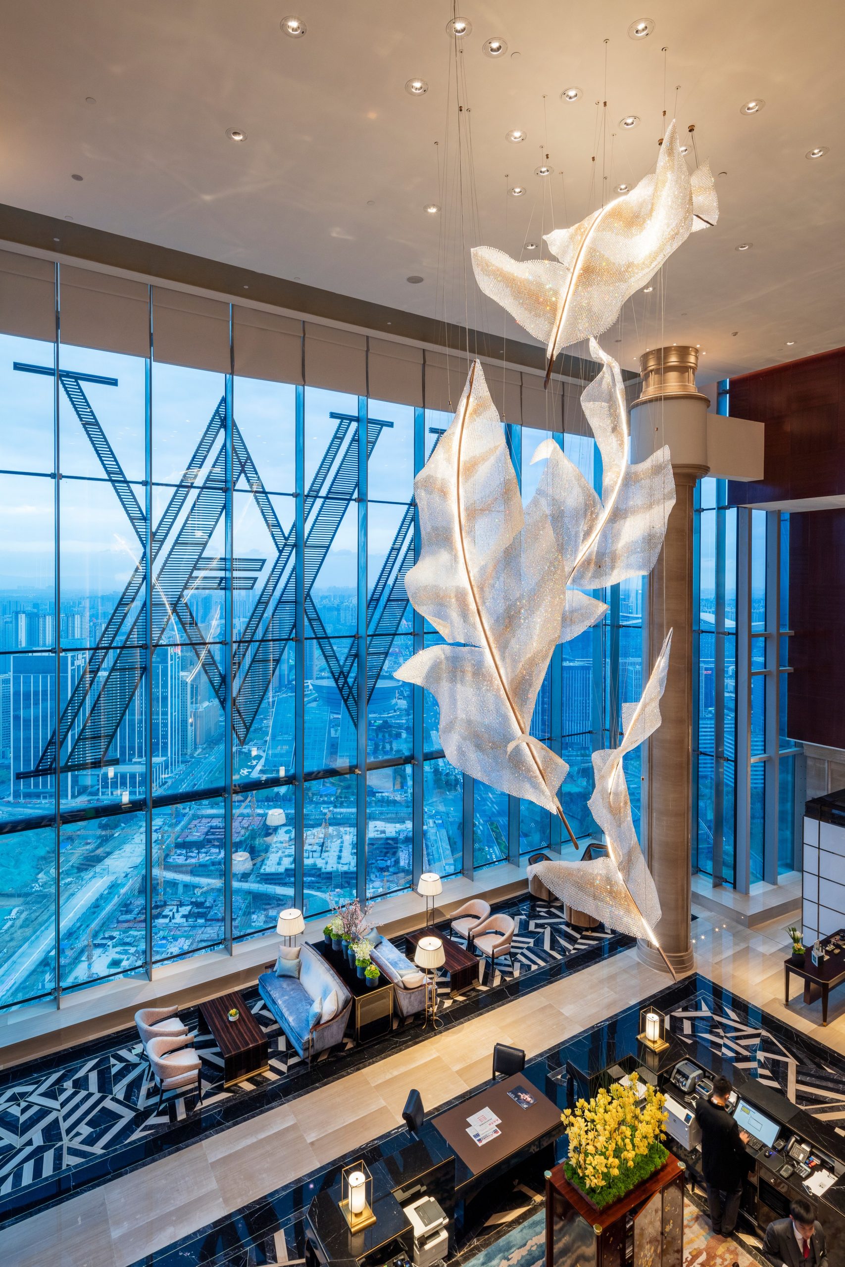ARIA crystal feather chandelier seen from the lobby balcony