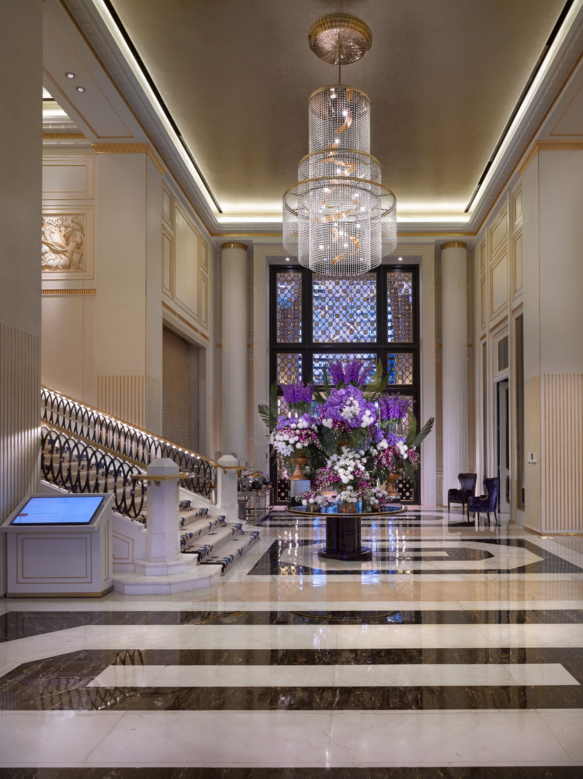 EMPIRE chandelier above a classical stair hall
