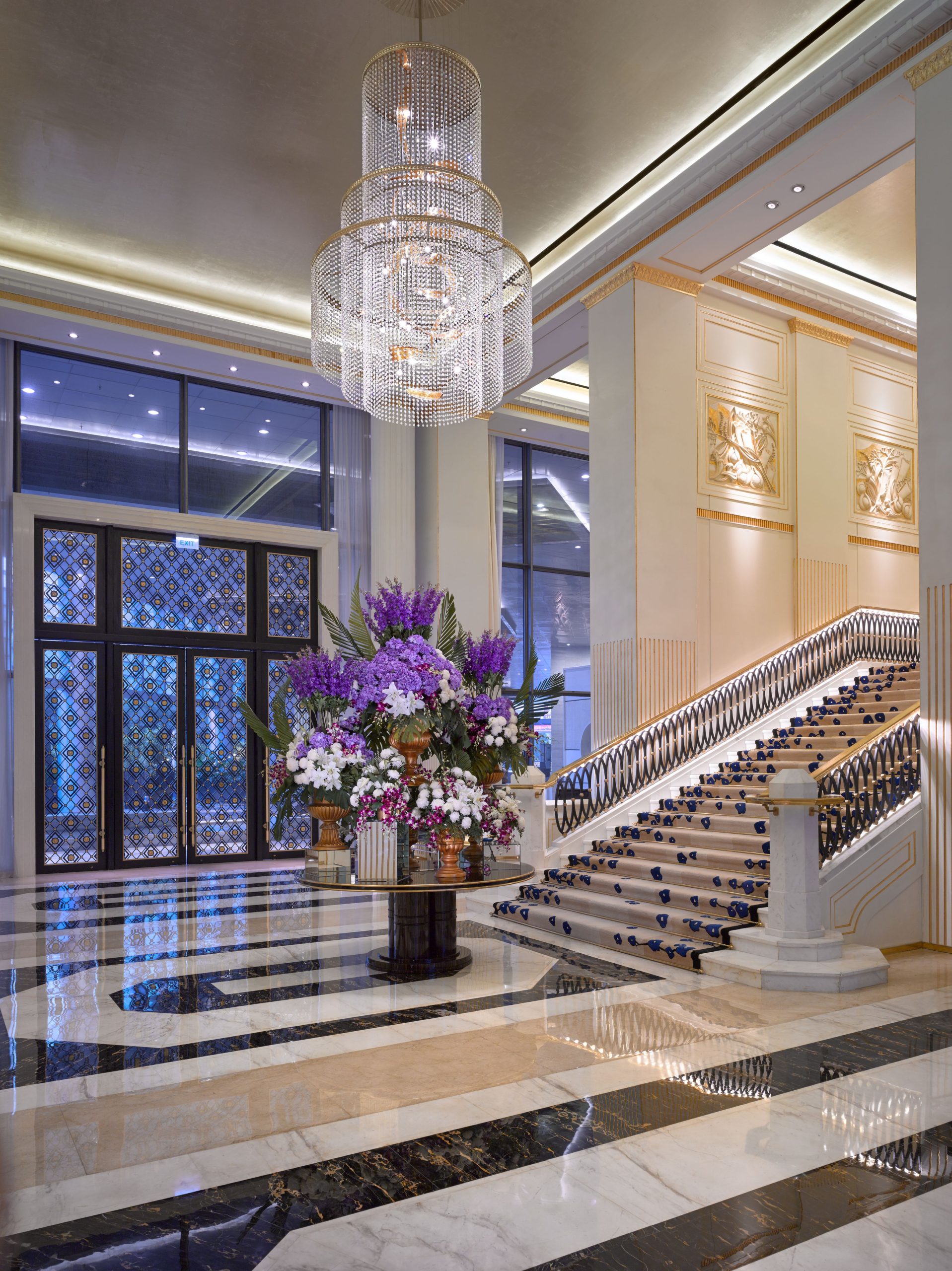 EMPIRE crystal chandelier over the staircase landing