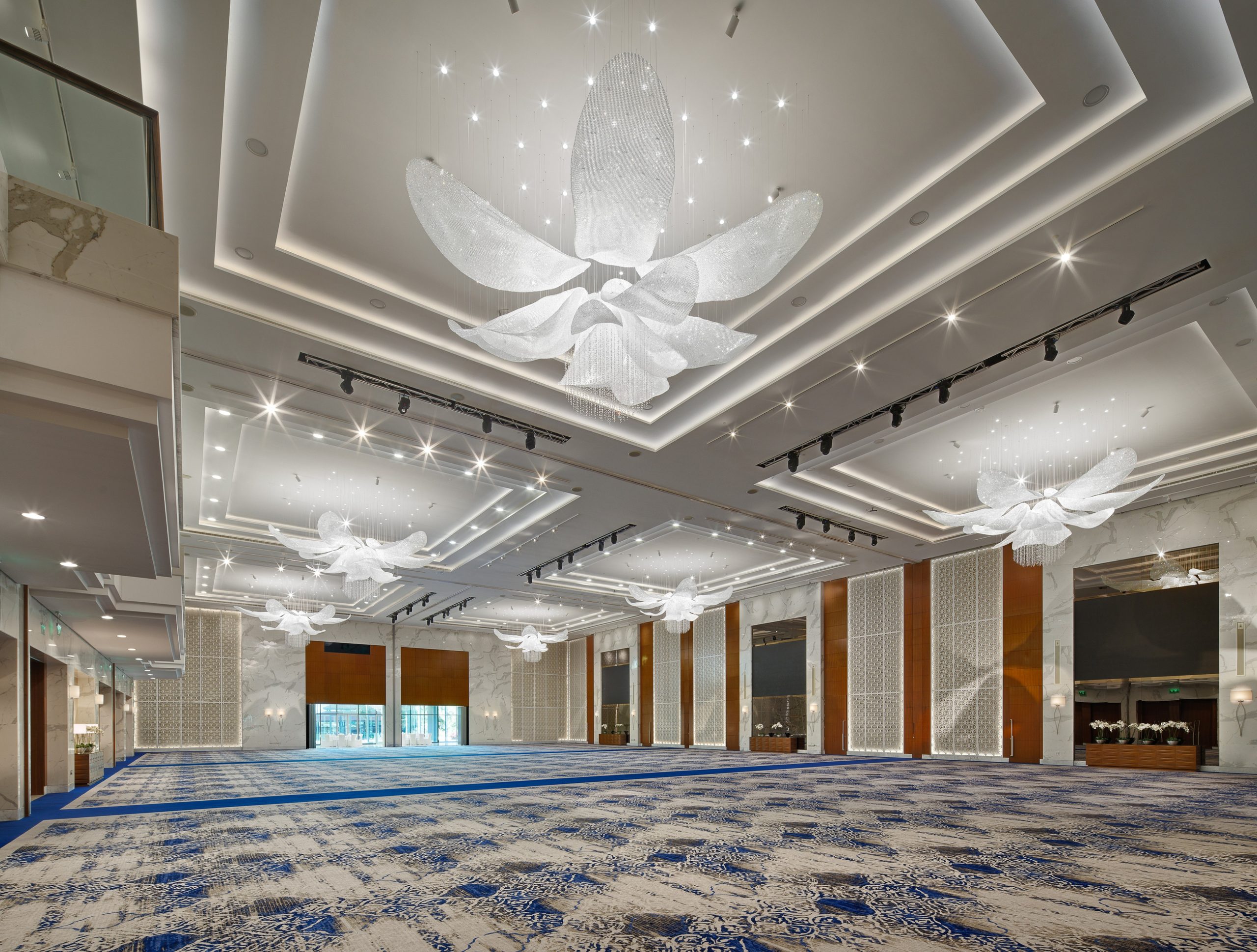 FLEUR crystal flower in white, ballroom seen down its full length