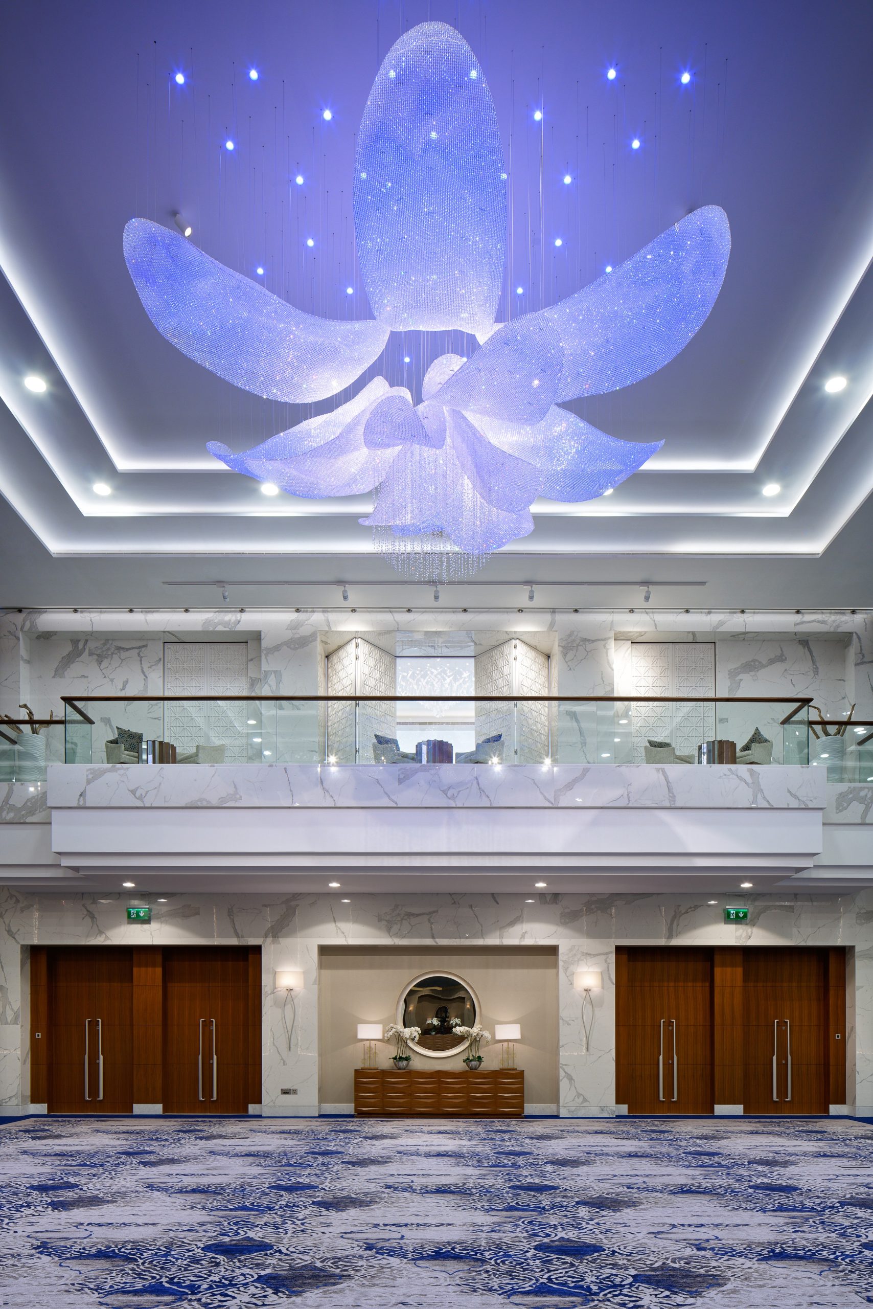 FLEUR crystal flower ceiling light lit in blue