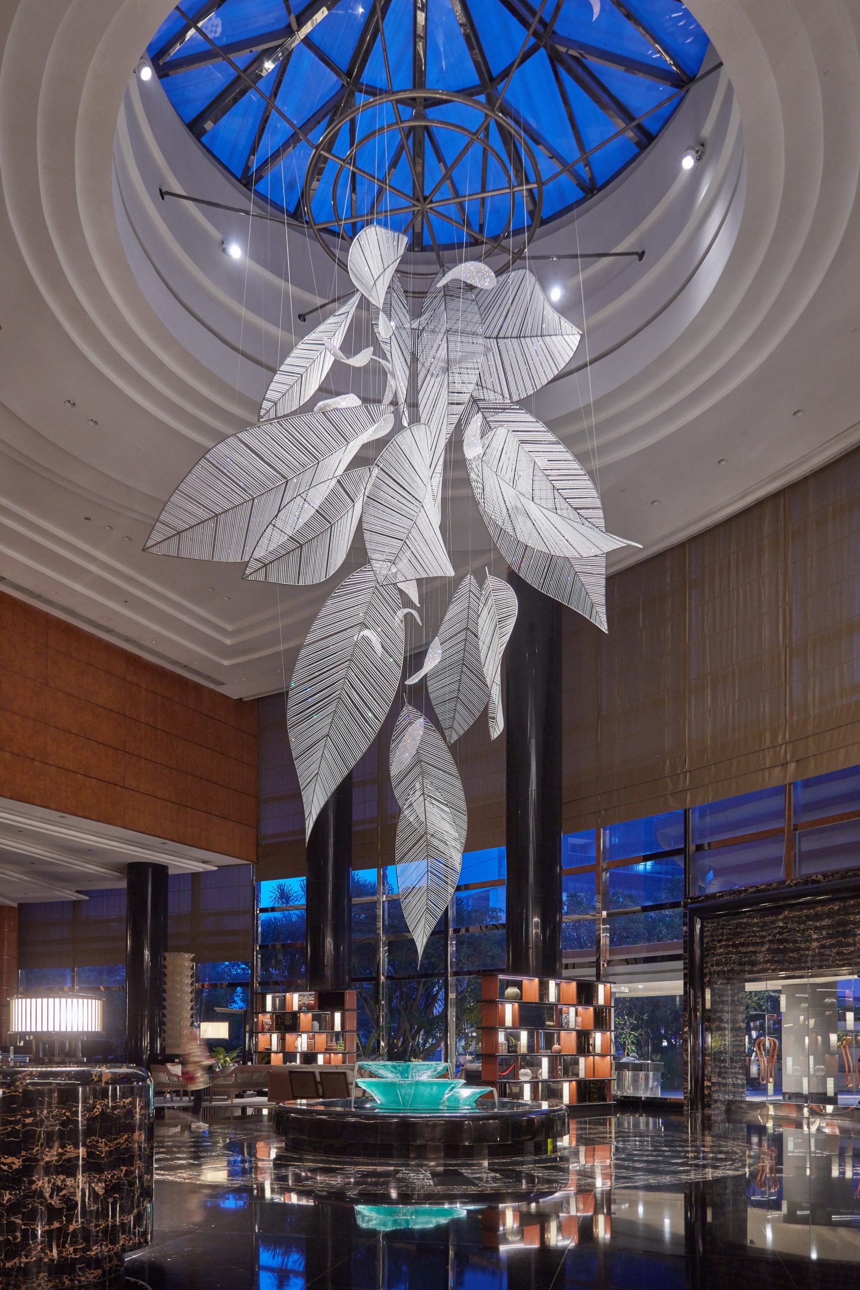 FOLIA chandelier under the skylight, wide lobby view