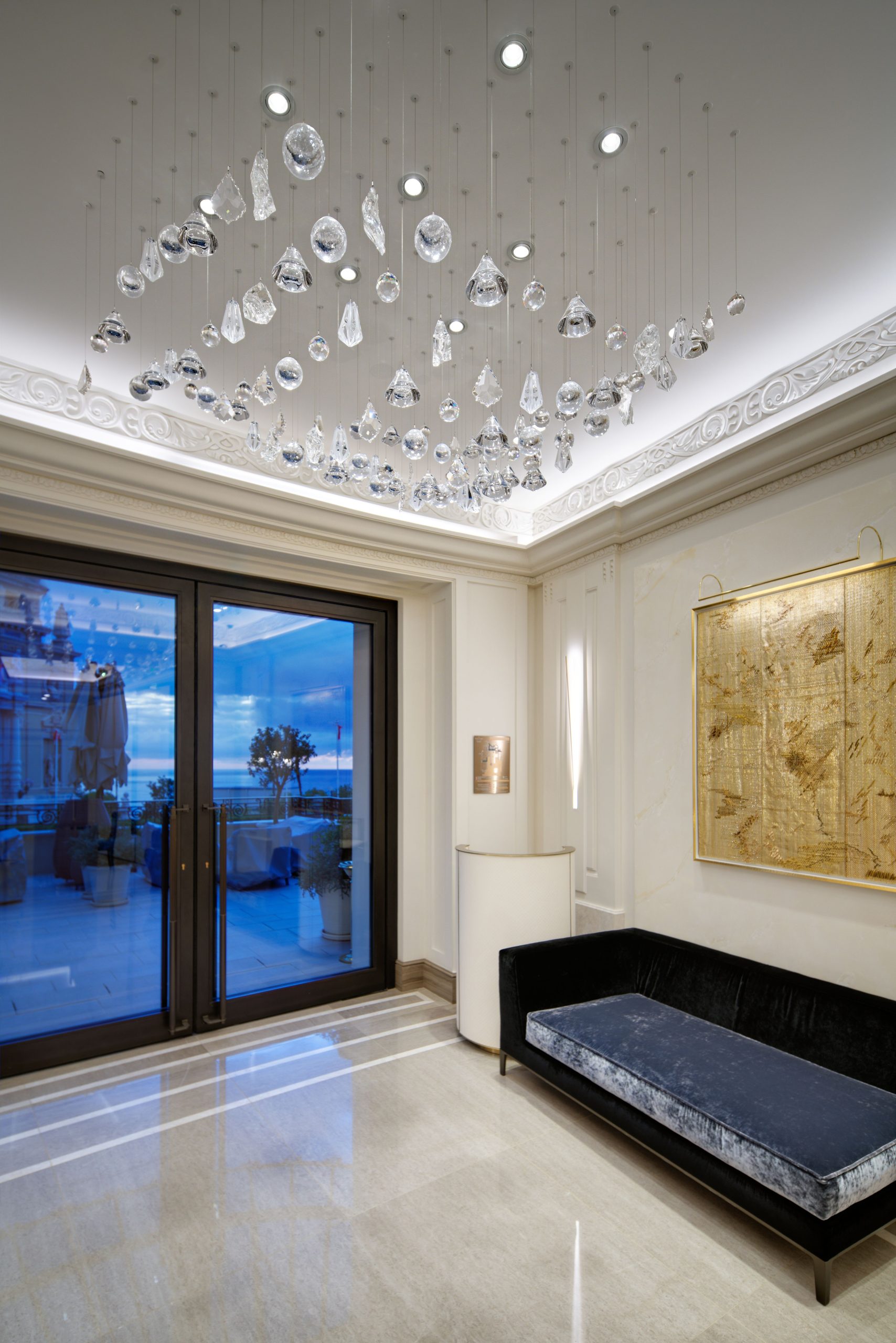 GLACIER crystal drop ceiling light seen against the window wall