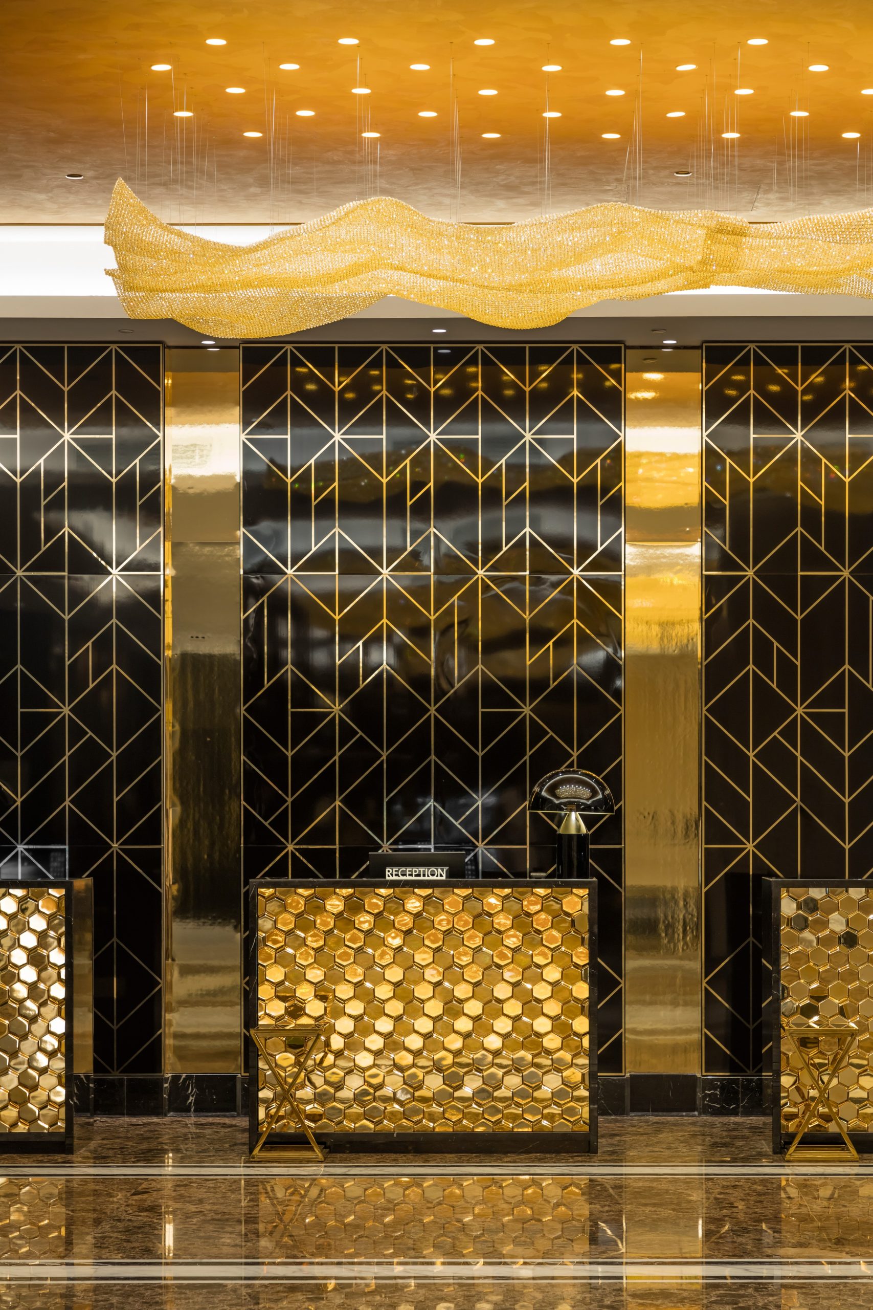 AURORA ceiling light, wave profile above the reception wall