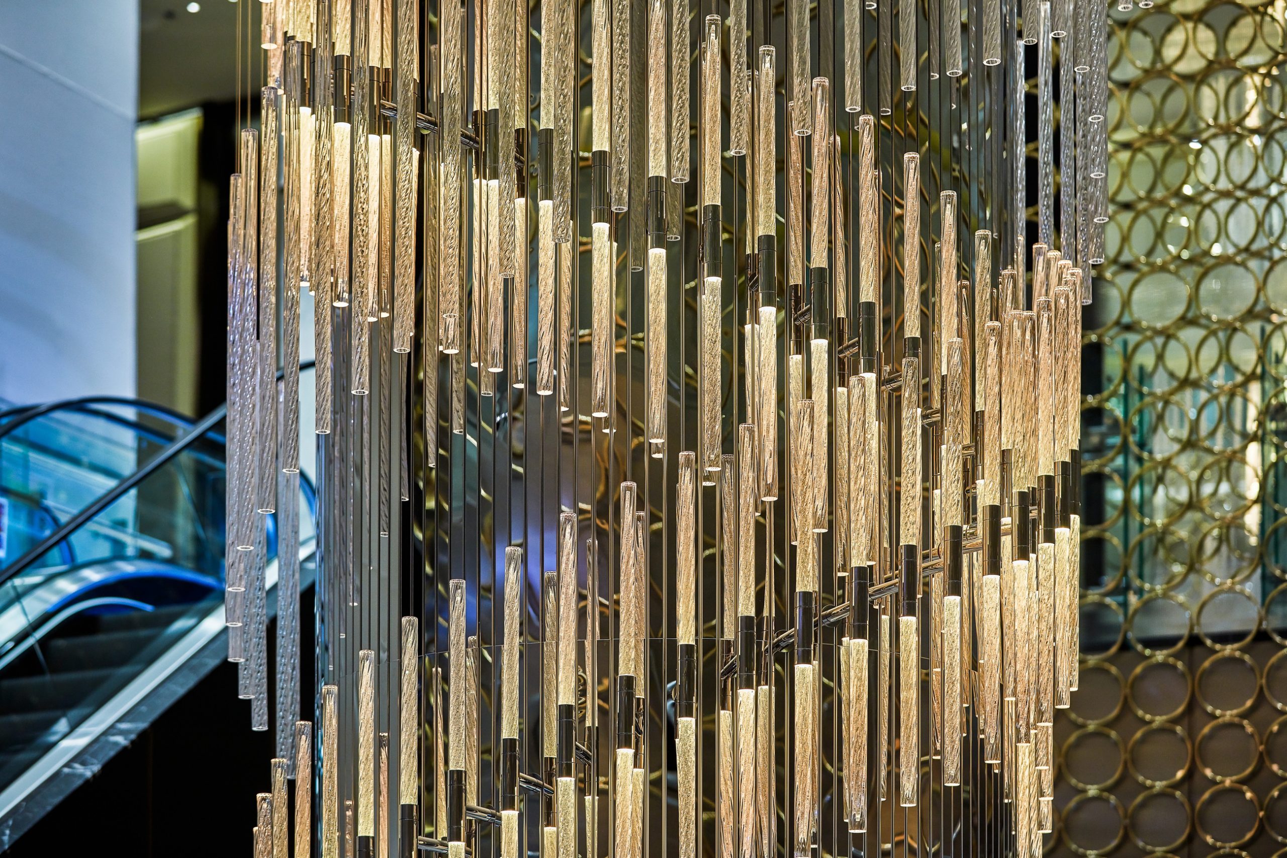 VORTEX crystal cascade against the perforated metal wall