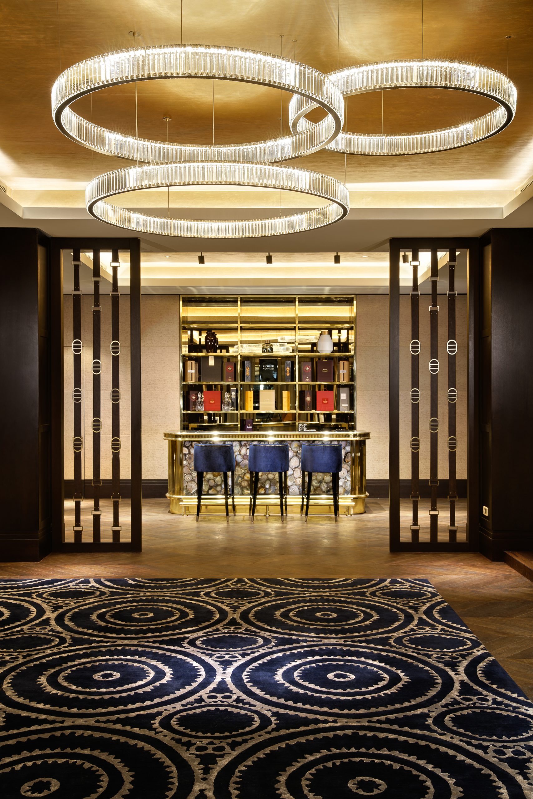 ORBIT ring chandelier above a hotel bar lounge