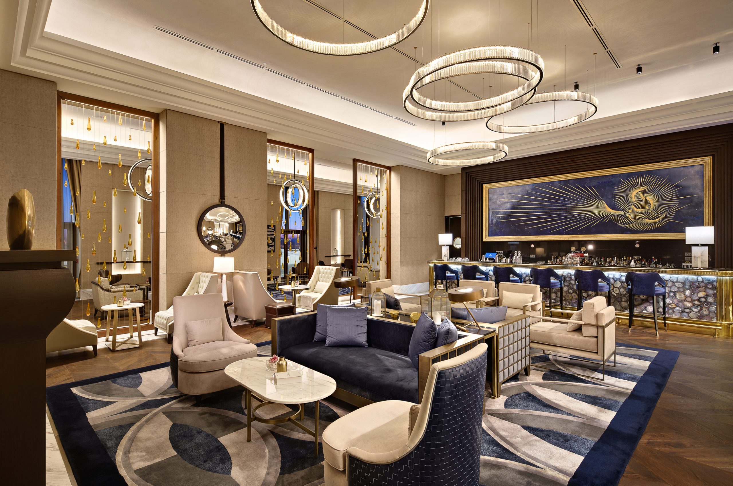 ORBIT ring chandelier over the lounge seating