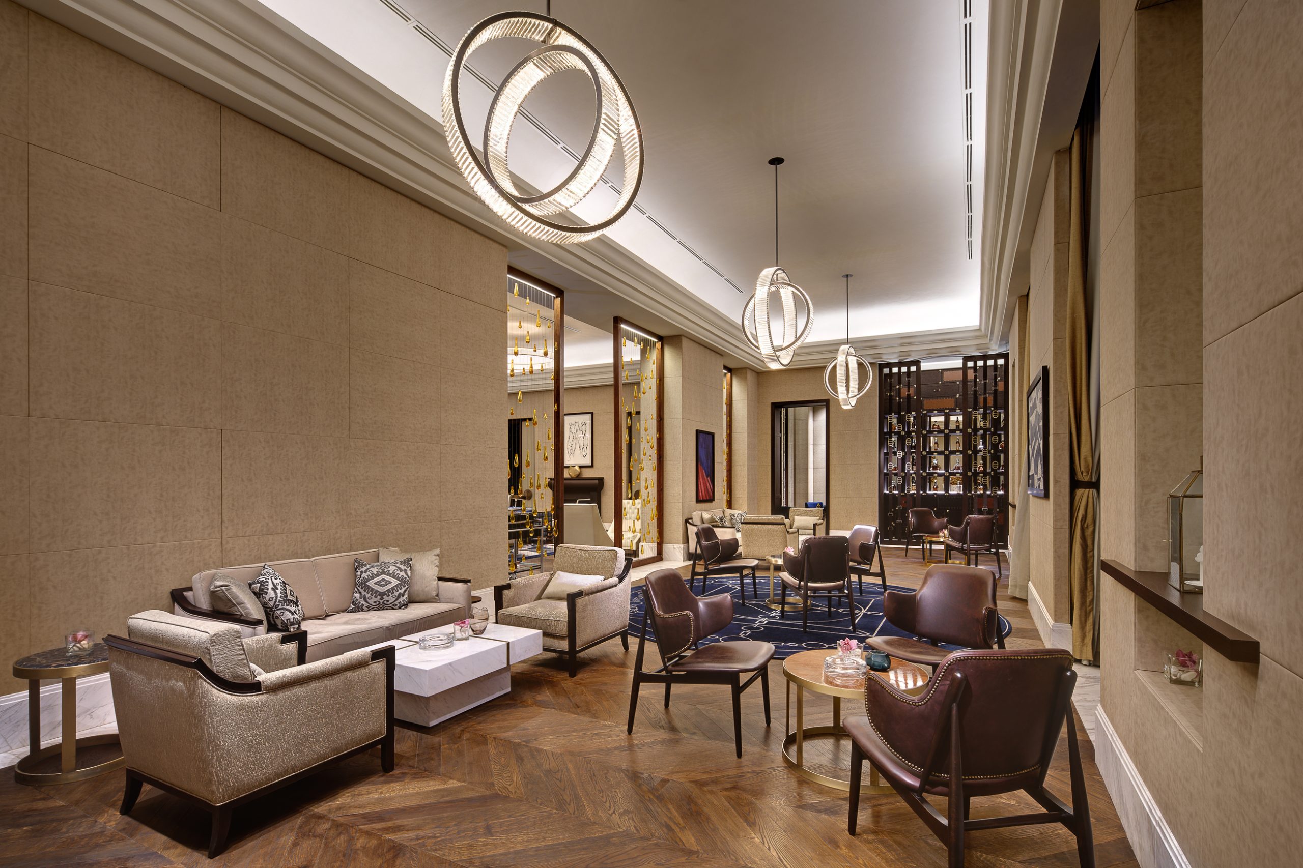 ORBIT ring chandeliers running down a longer lounge