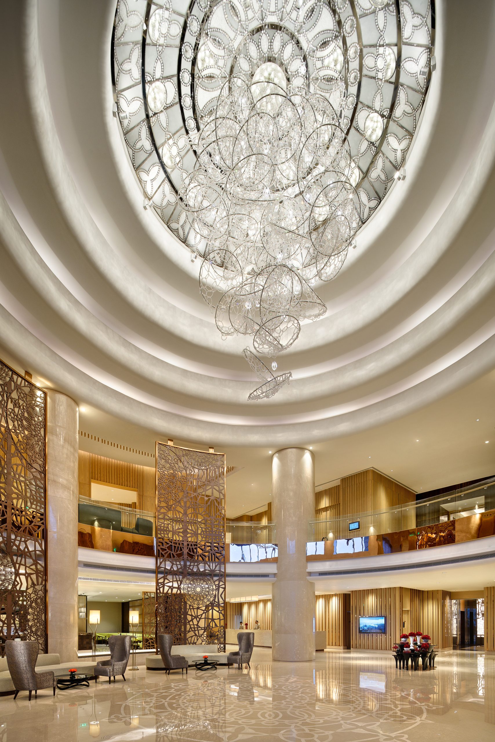 CIRRUS chandelier beneath the rippled rotunda ceiling