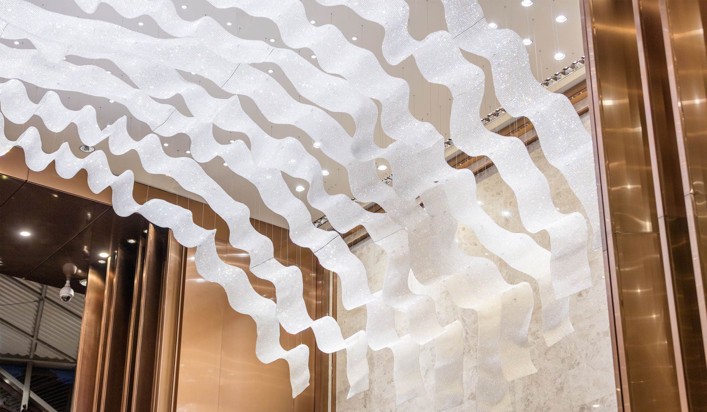 THALASSA crystal wave ceiling light by SHUCHUANG, close view of the rippled mesh strips