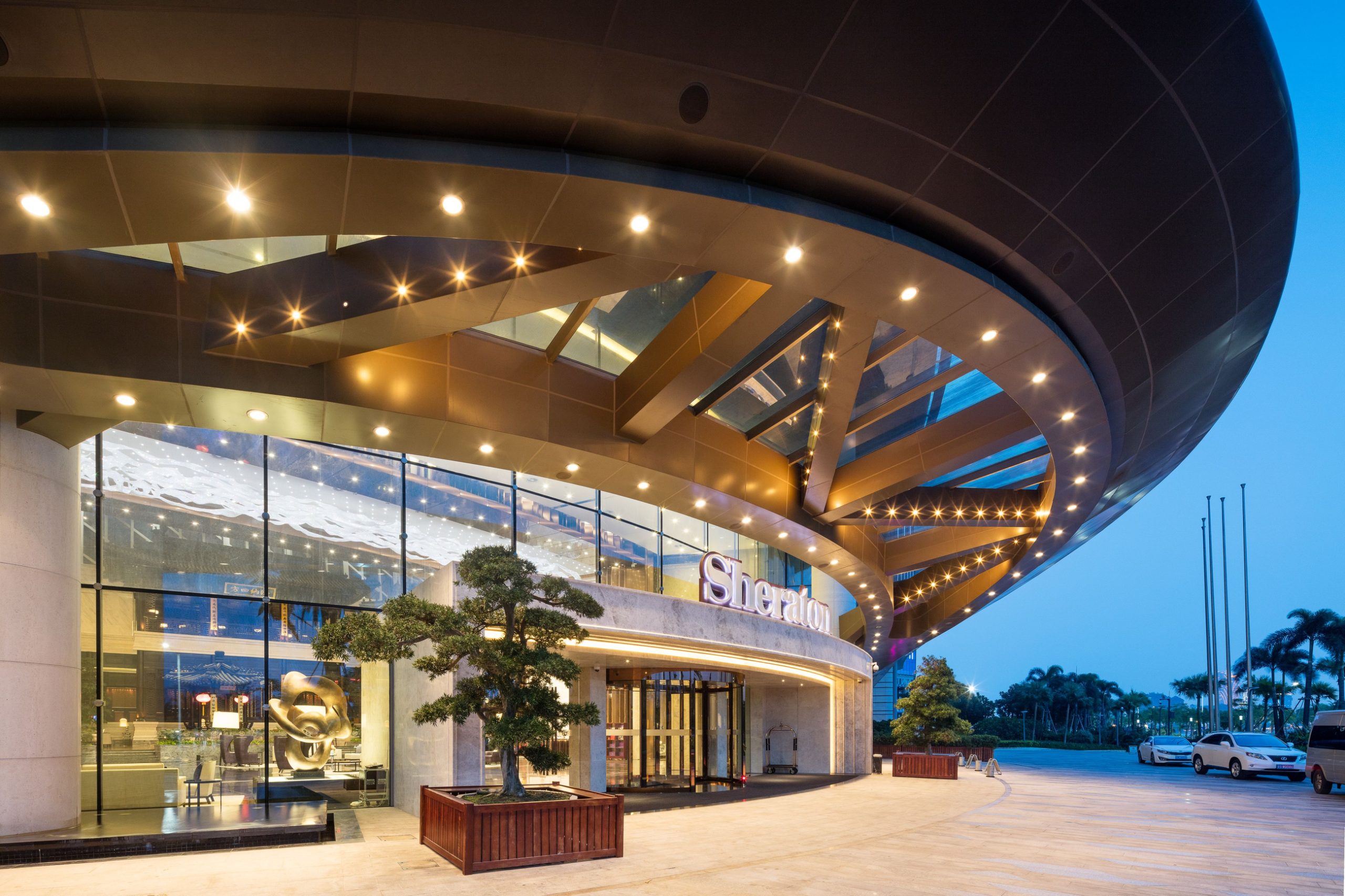 THALASSA crystal wave ceiling light seen from the lobby entrance