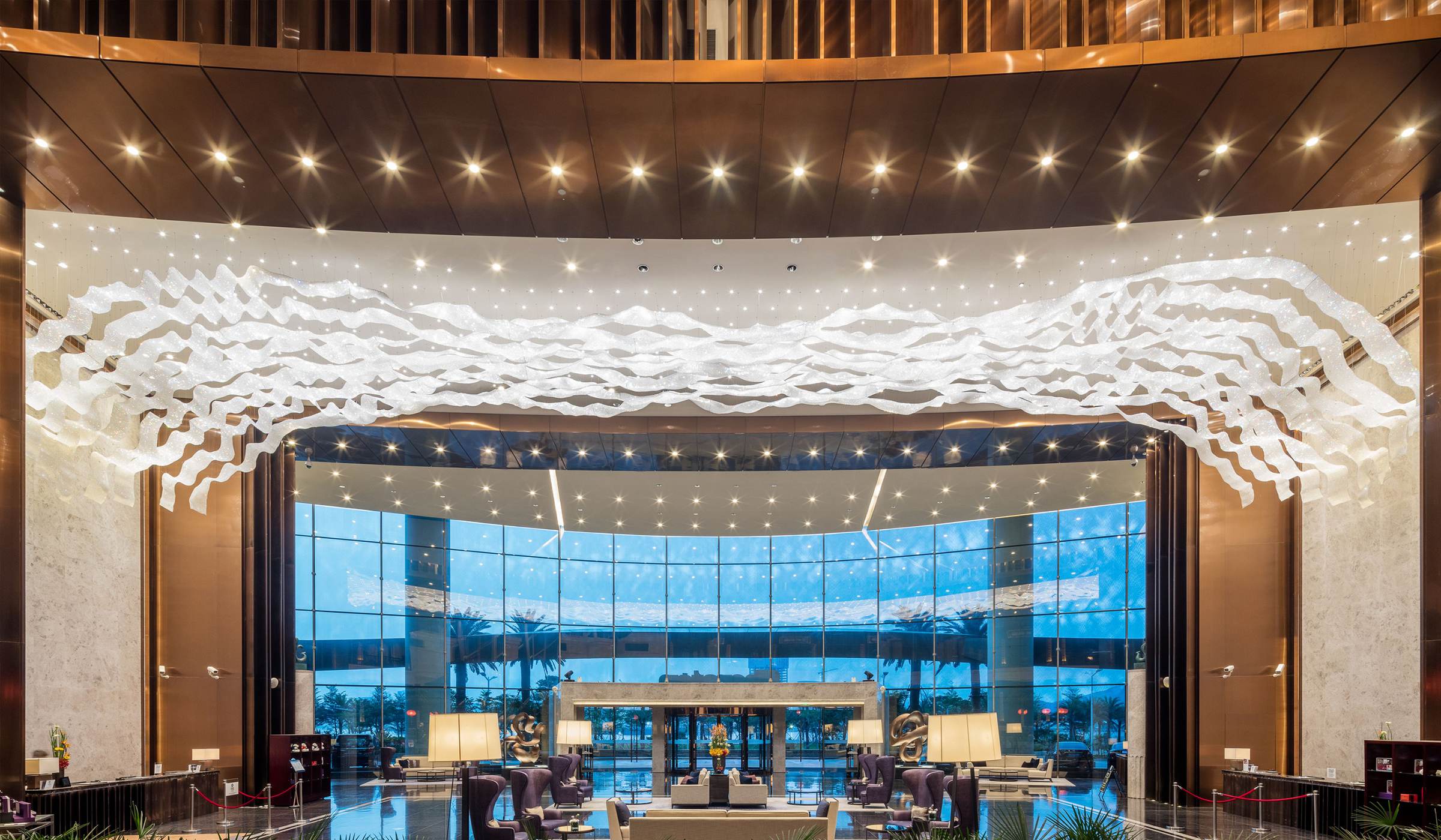 THALASSA crystal wave seen against the lobby window wall