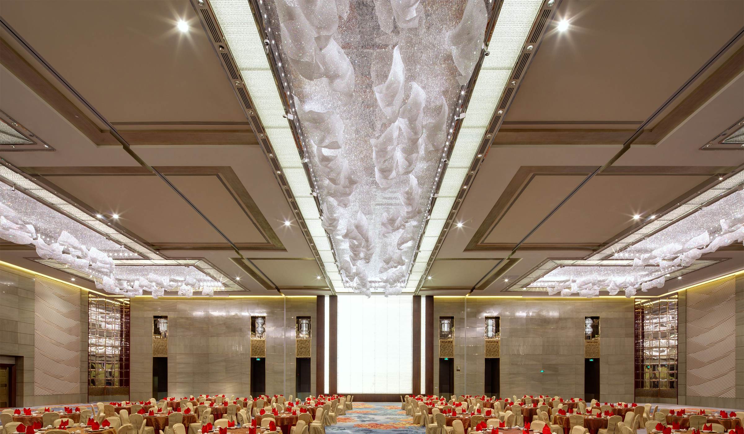 CELESTE cloud chandelier run as a line down a ballroom ceiling