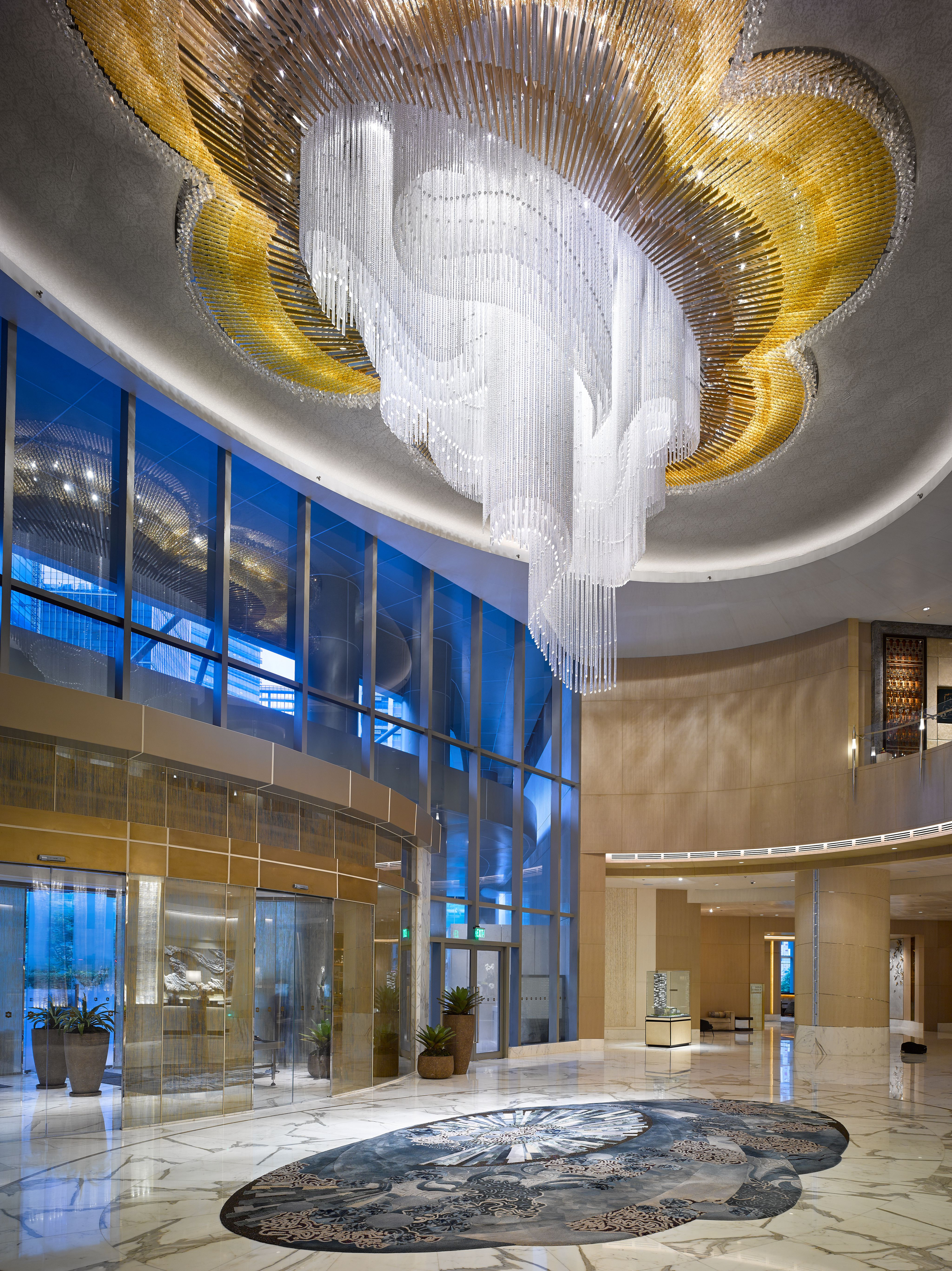 MAGNOLIA chandelier dropping through a hotel lobby atrium