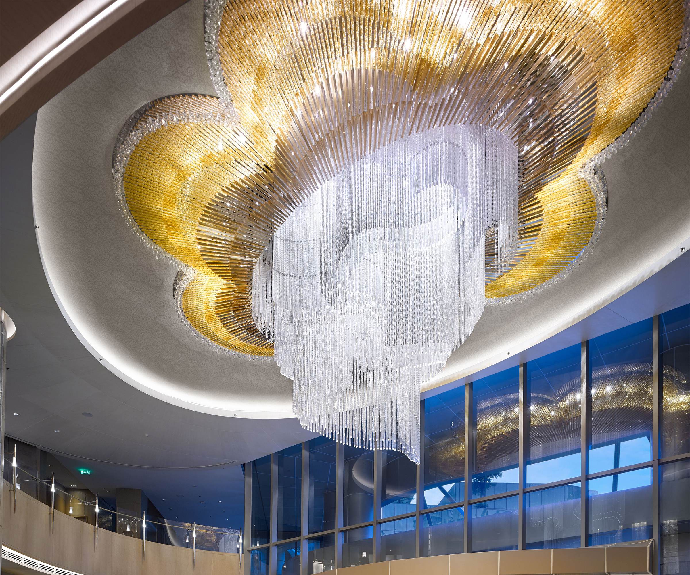 MAGNOLIA chandelier seen from the mezzanine, gold lobes above