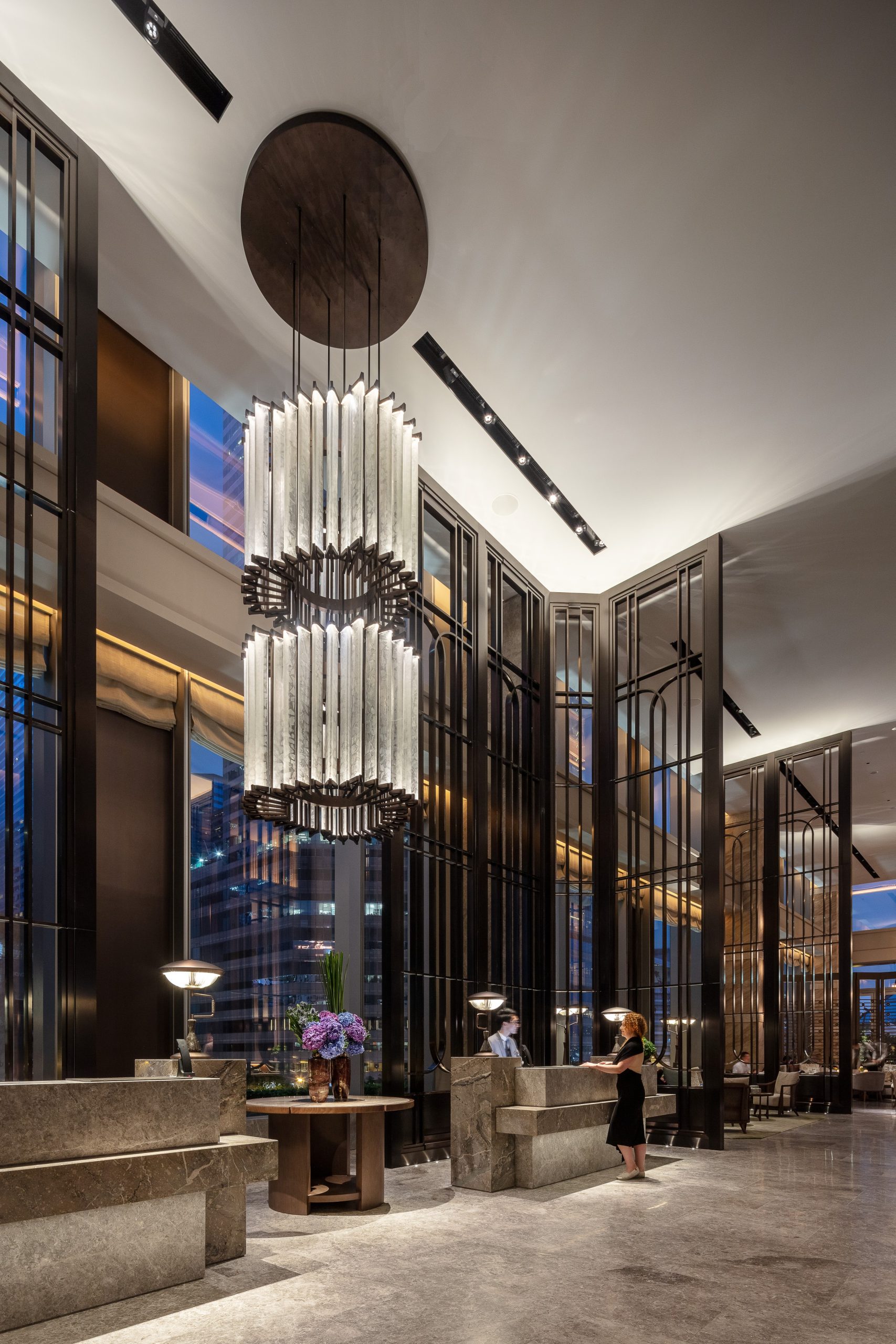 TITAN chandelier lit in the evening