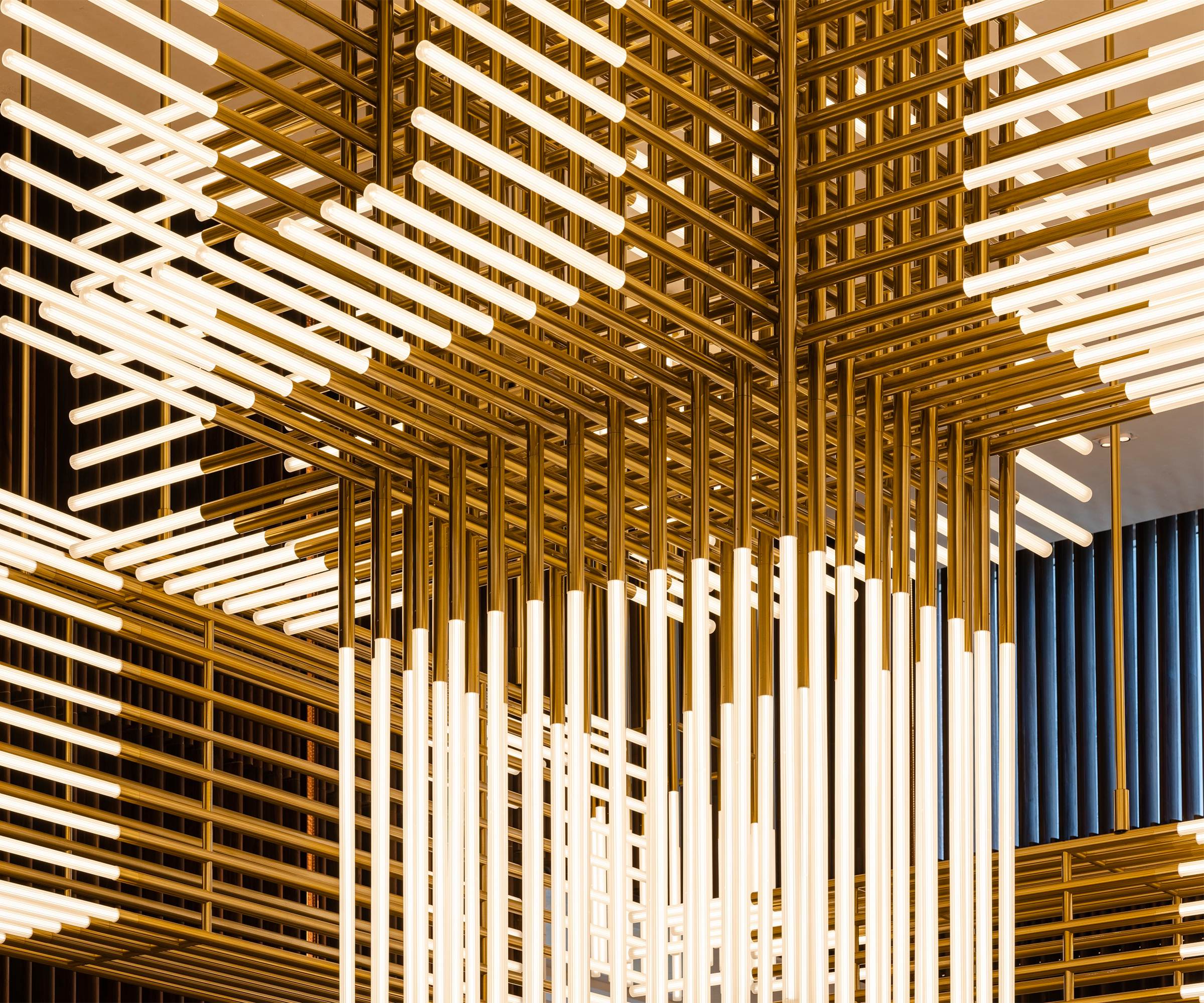 GRIFFIN custom lobby chandelier by SHUCHUANG, full view in a reception lounge