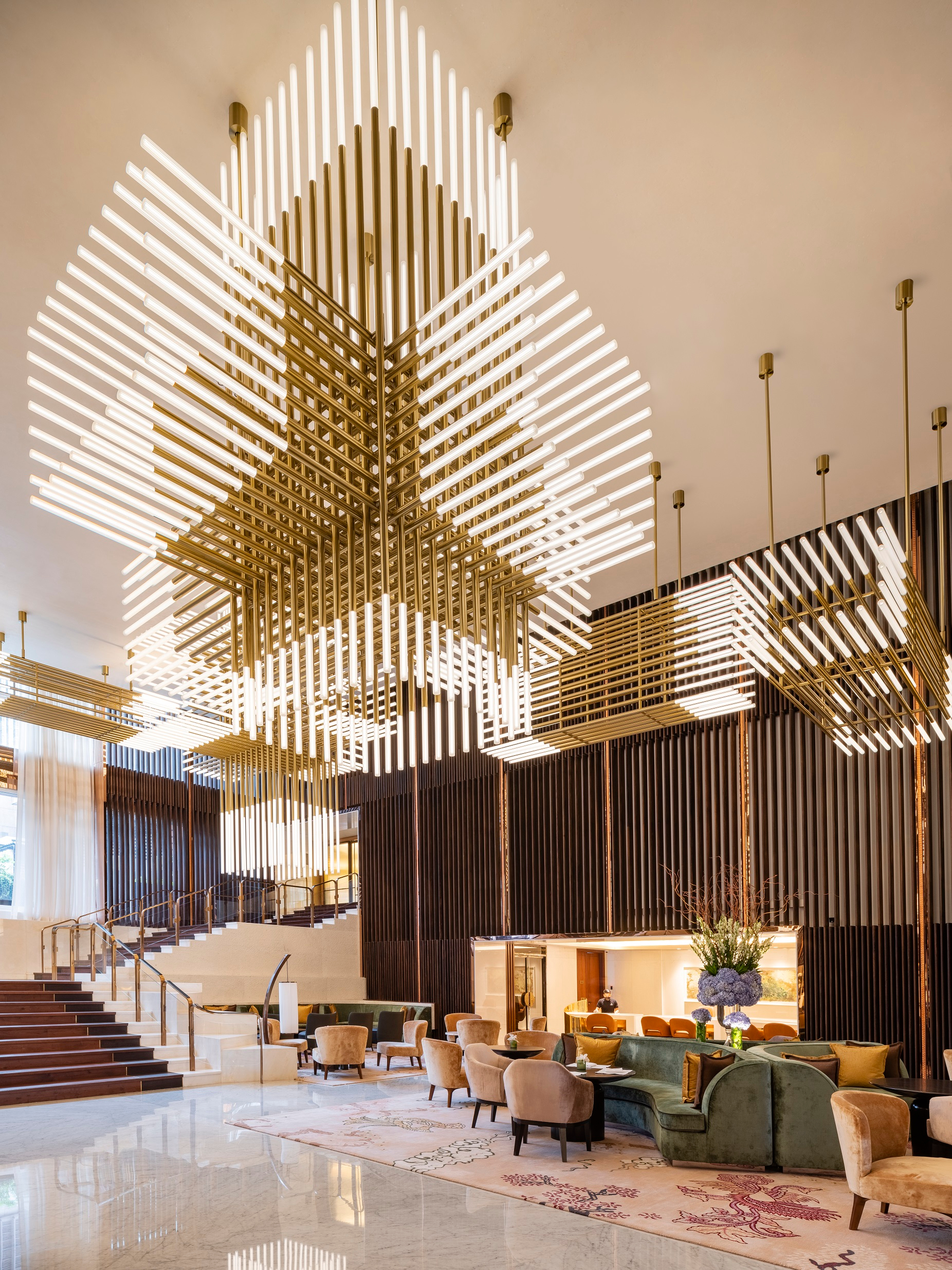 GRIFFIN lit in a reception lounge, wide interior view