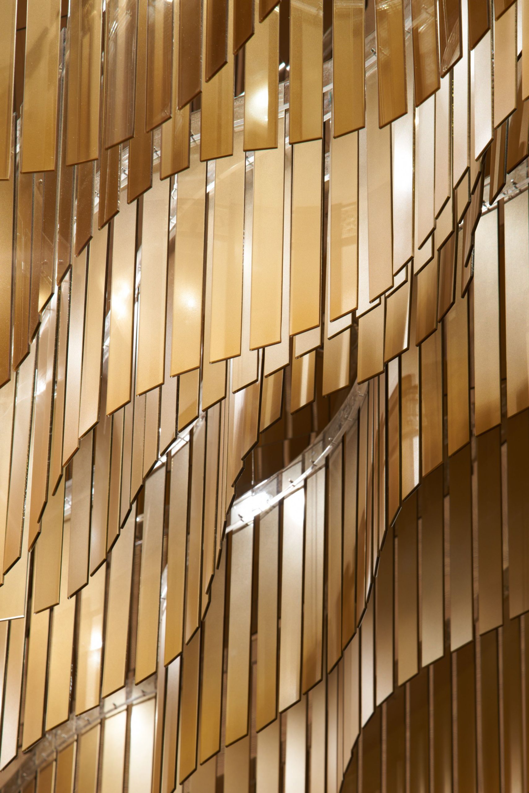 PAVILION chandelier, layered blade edges forming a wave contour