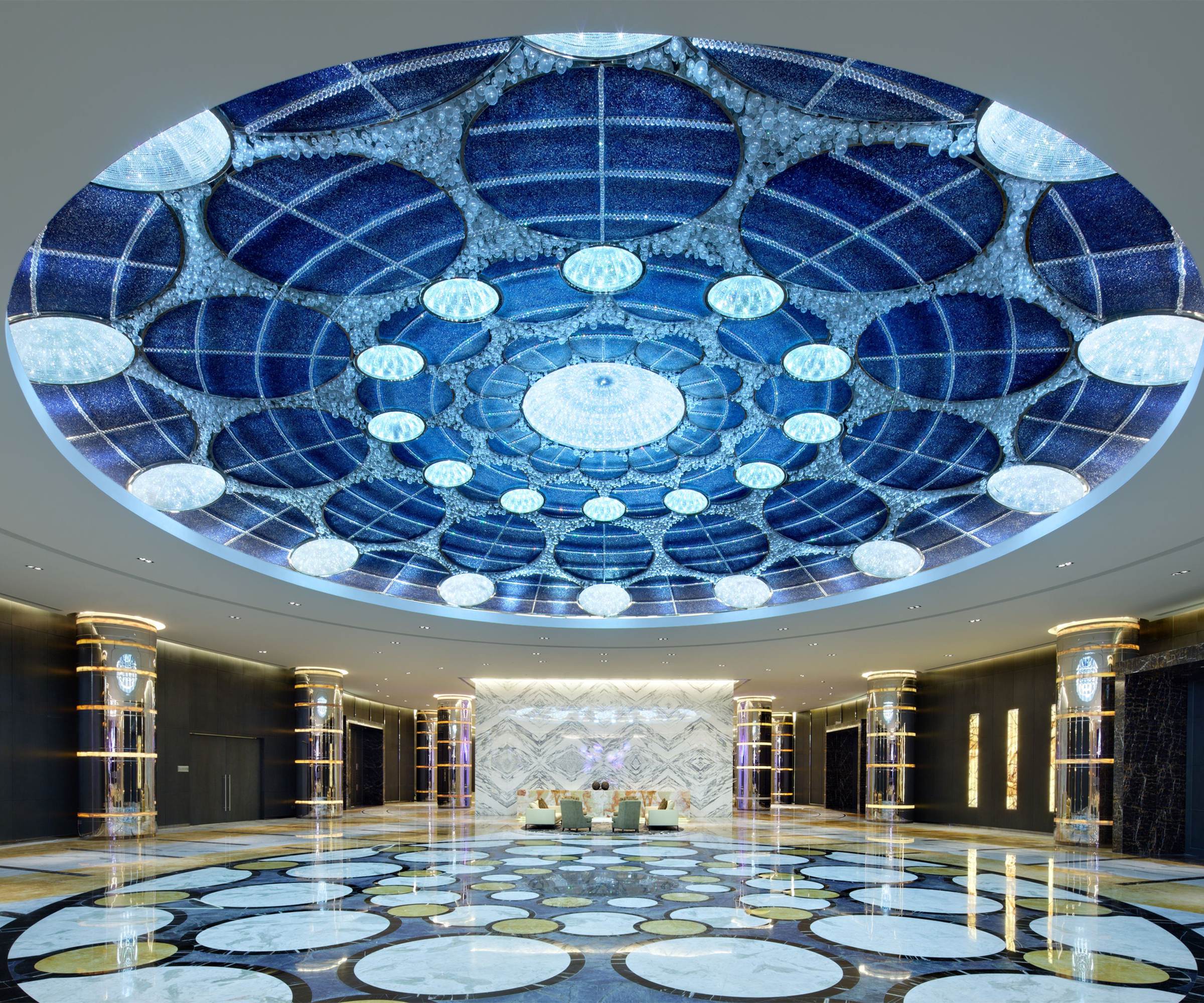 AZURE blue glass dome seen from the hotel lobby floor below