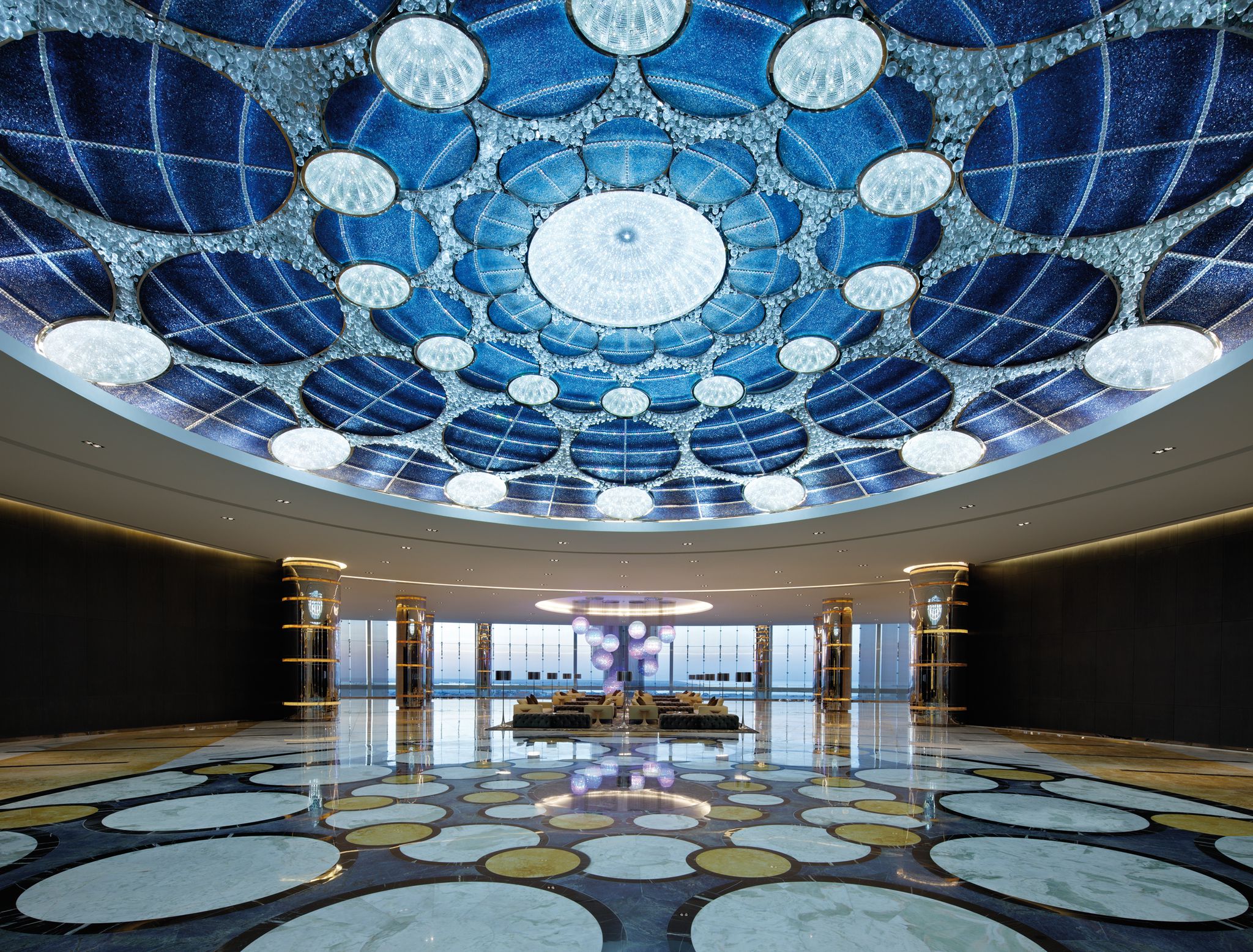 AZURE dome ceiling light above a lobby with matching radial floor inlay