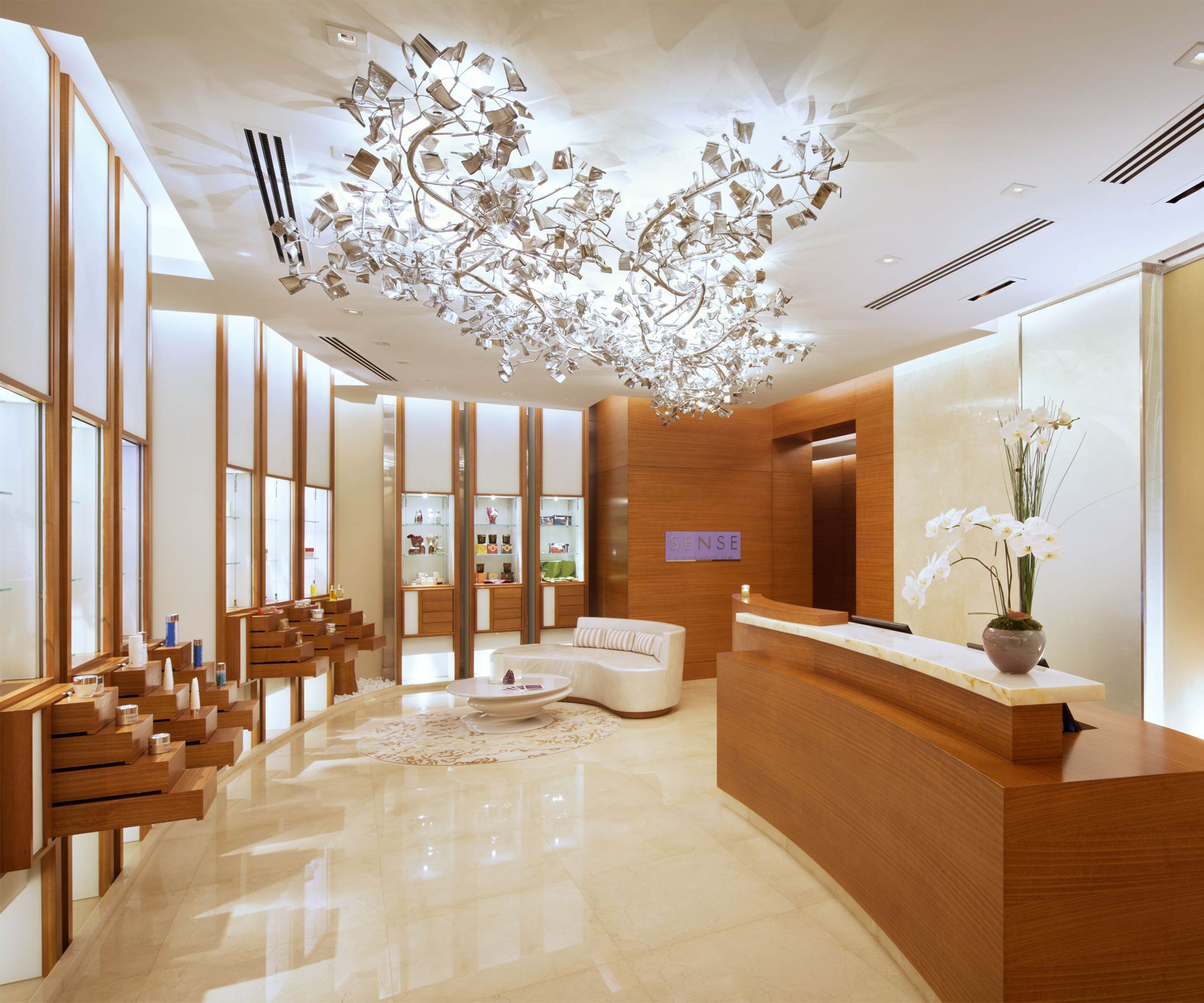 FROST chandelier spreading across a reception ceiling