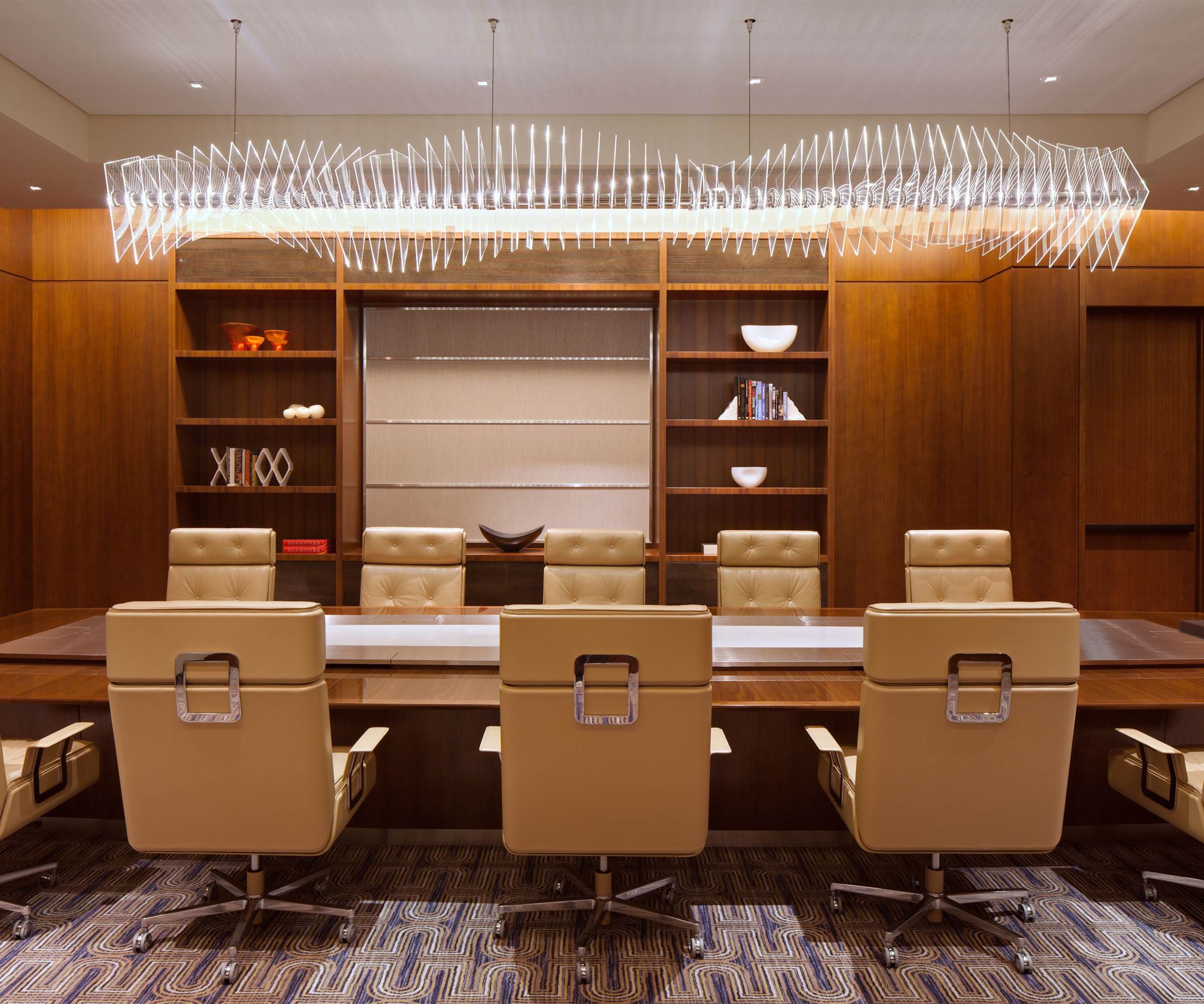 WEBB linear chandelier seen from the opposite end of the boardroom