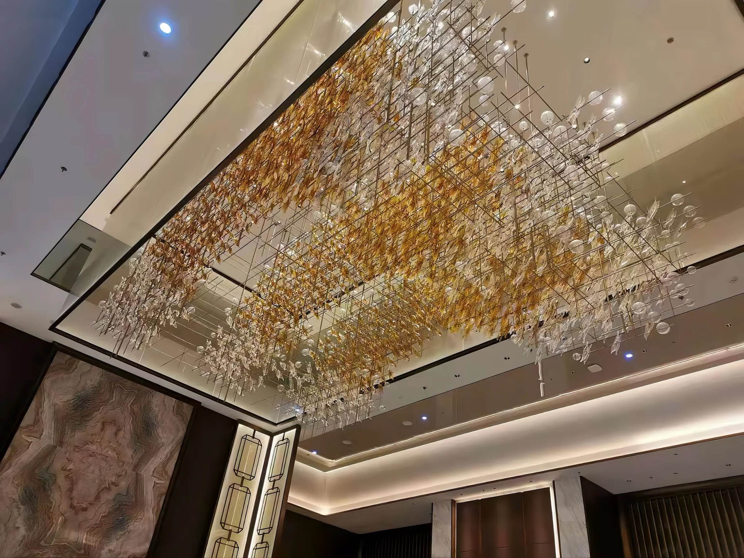 AUTUMNUS ceiling installation lit in the evening