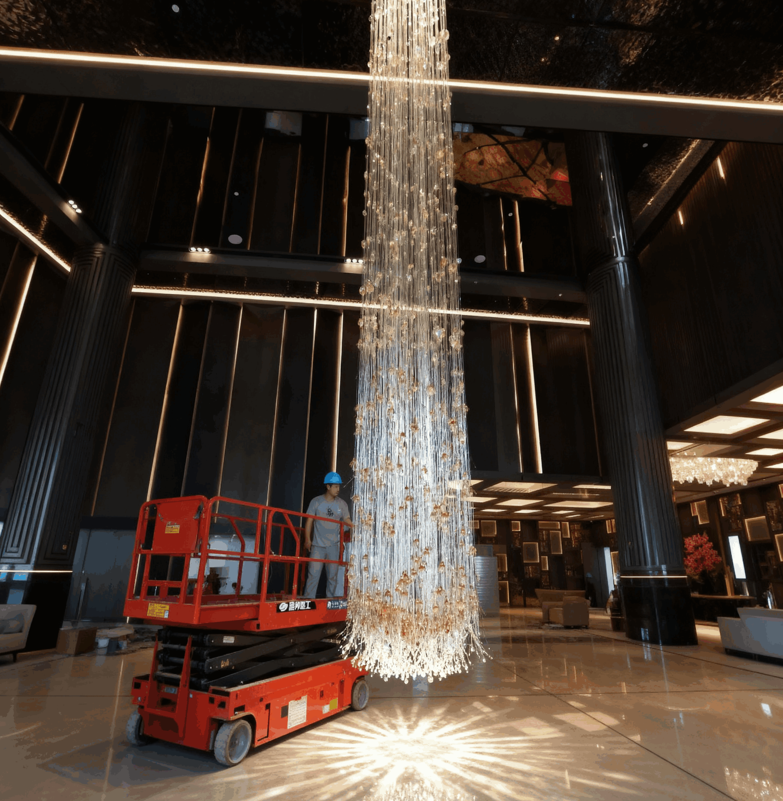 RAINFALL cascading glass chandelier by SHUCHUANG, full view in a hotel lobby